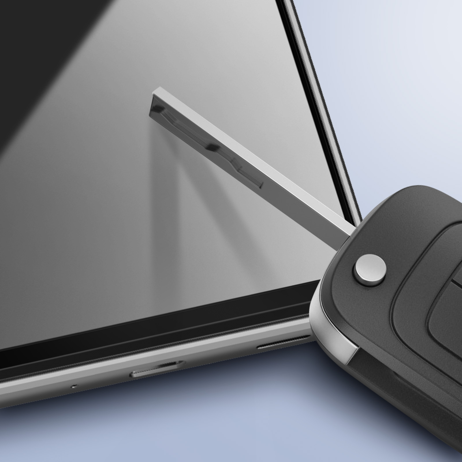 Una chiave dell'auto con telecomando nero e chiave in metallo davanti a un tablet. Lo sfondo è azzurro e grigio.