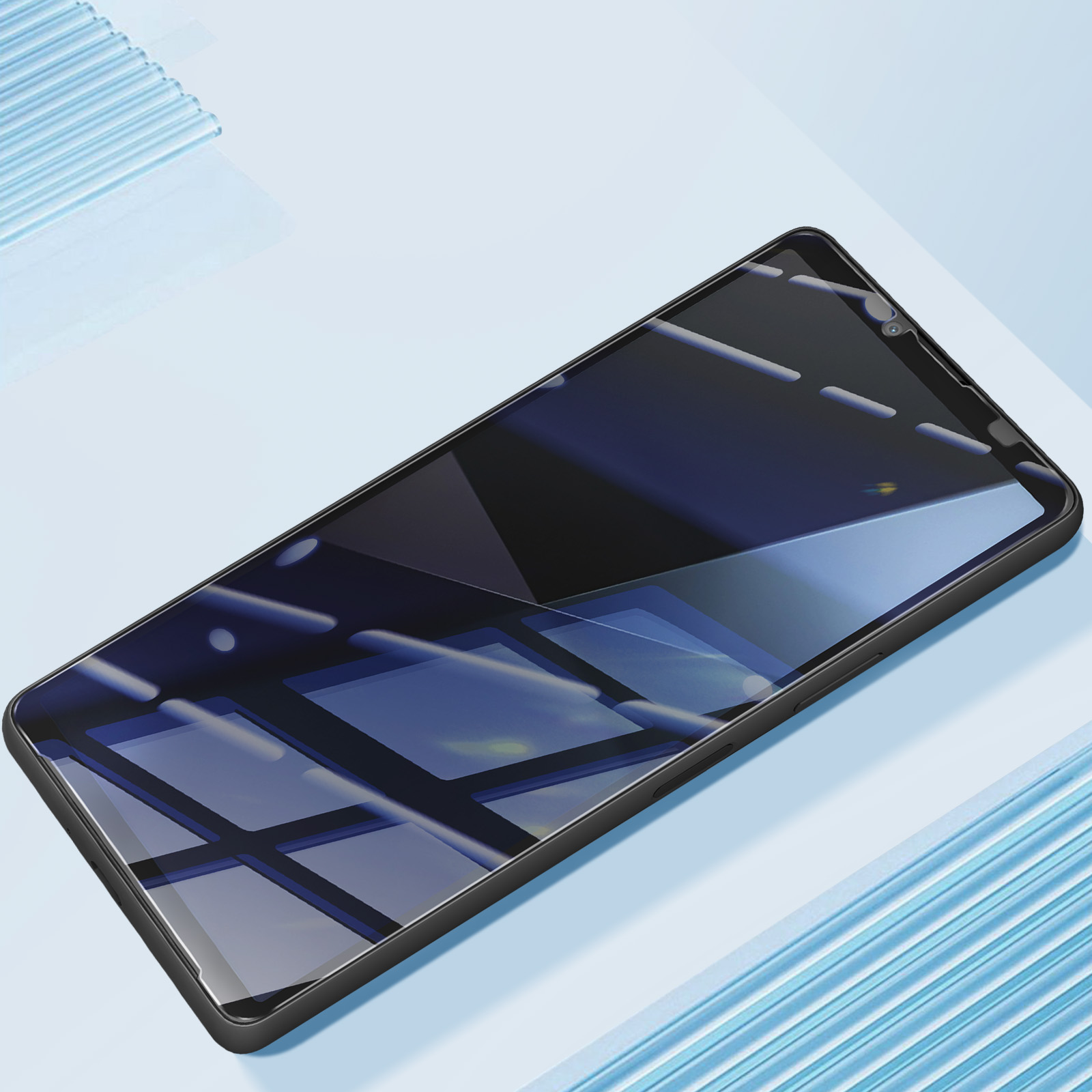 Uno smartphone nero con schermo riflettente è su una superficie azzurra. Riflessi di una stanza sono visibili sullo schermo.