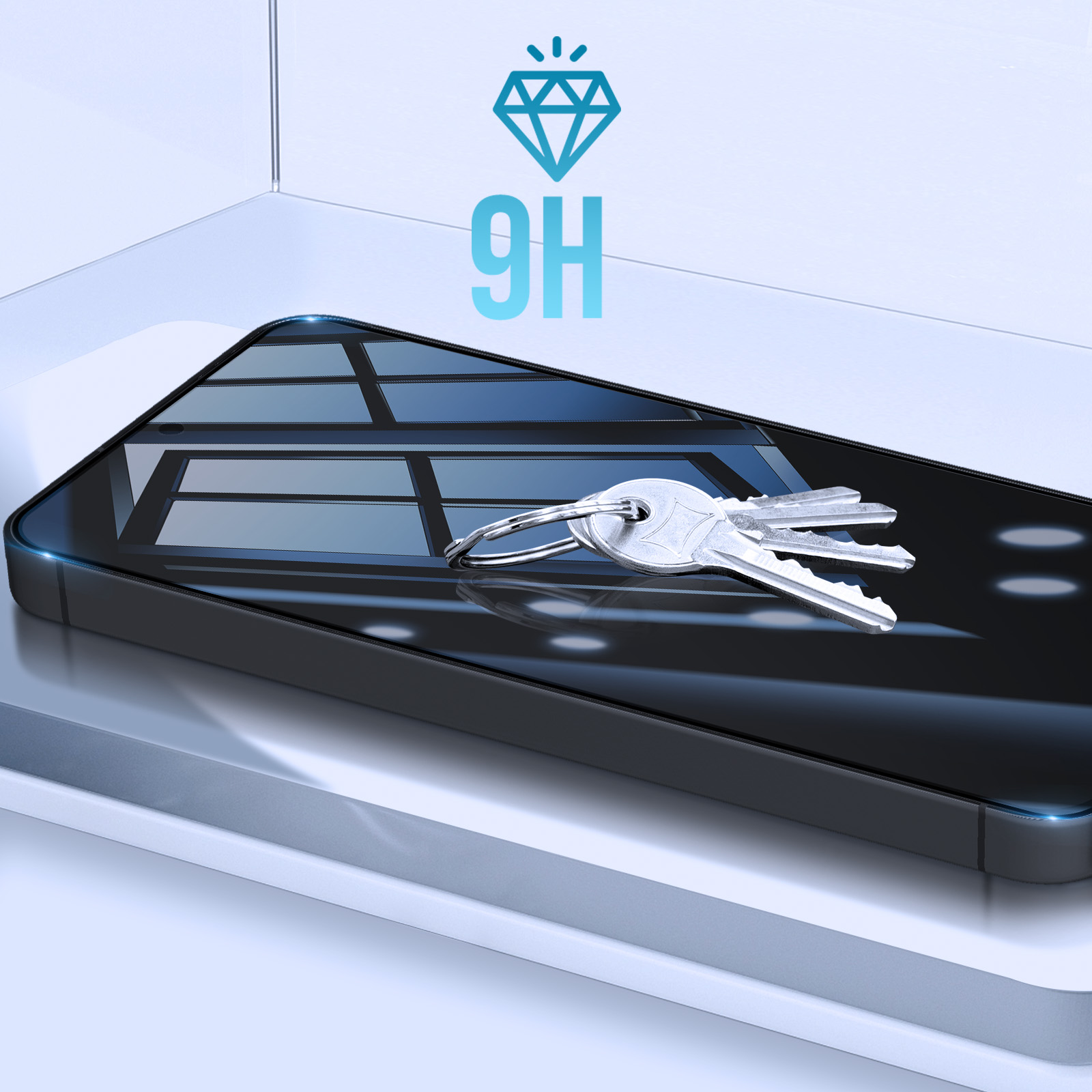 Uno smartphone con protezione schermo e chiavi sopra. Un'icona diamante 9H in alto. Superficie bianca.