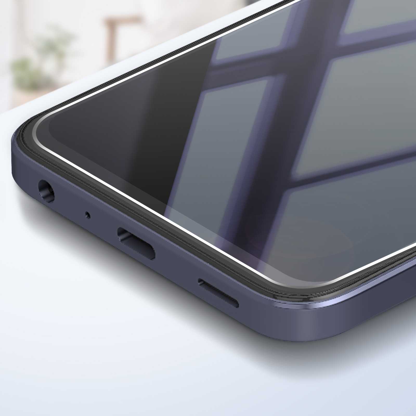 Primo piano di un telefono scuro. Lo schermo riflette una finestra. Il telefono è blu scuro, con uno schermo lucido.