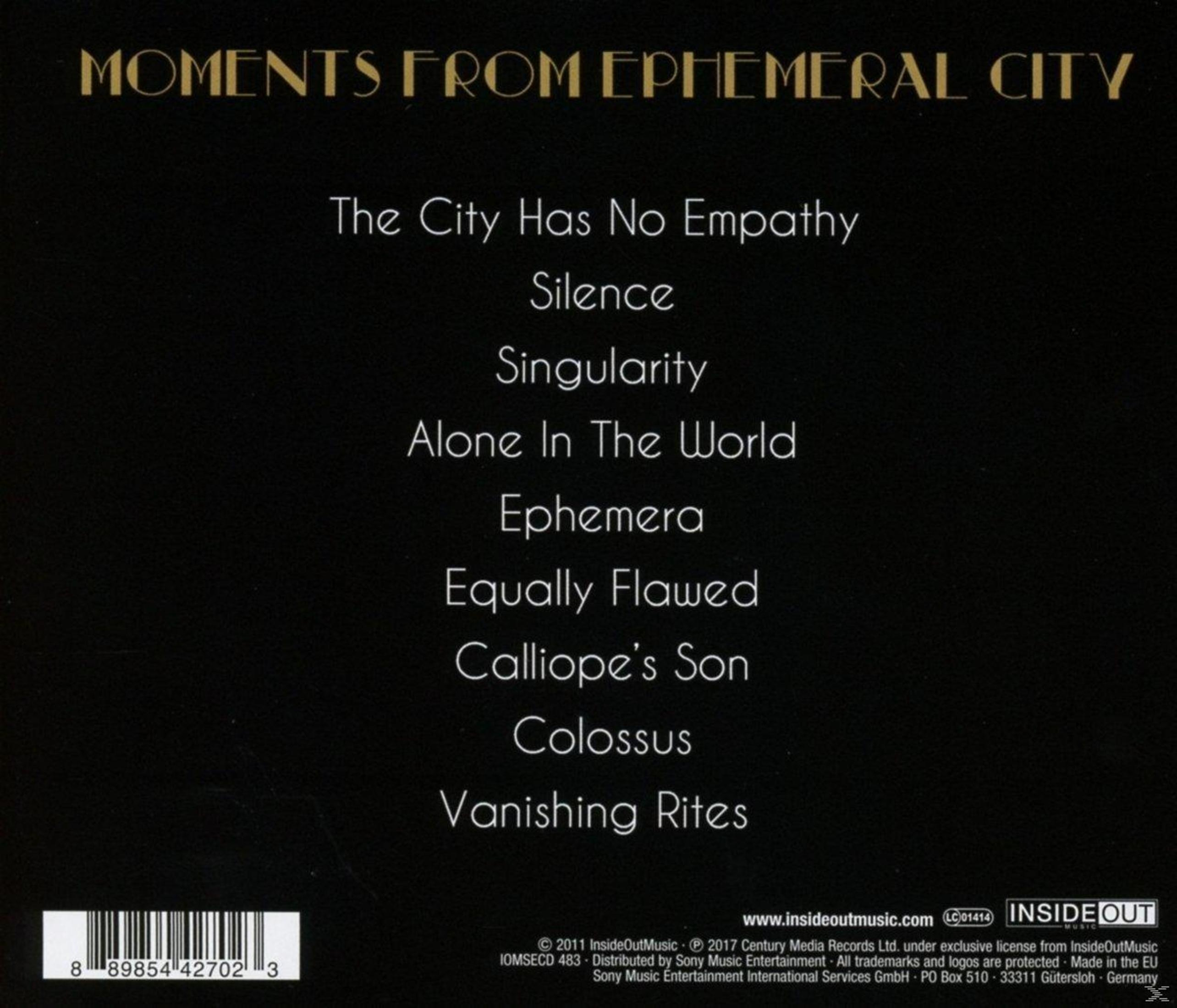 Albumcover mit goldfarbenem Text auf Schwarz. Titel: Moments From Ephemeral City. Trackliste und Copyright-Informationen sind ebenfalls vorhanden.