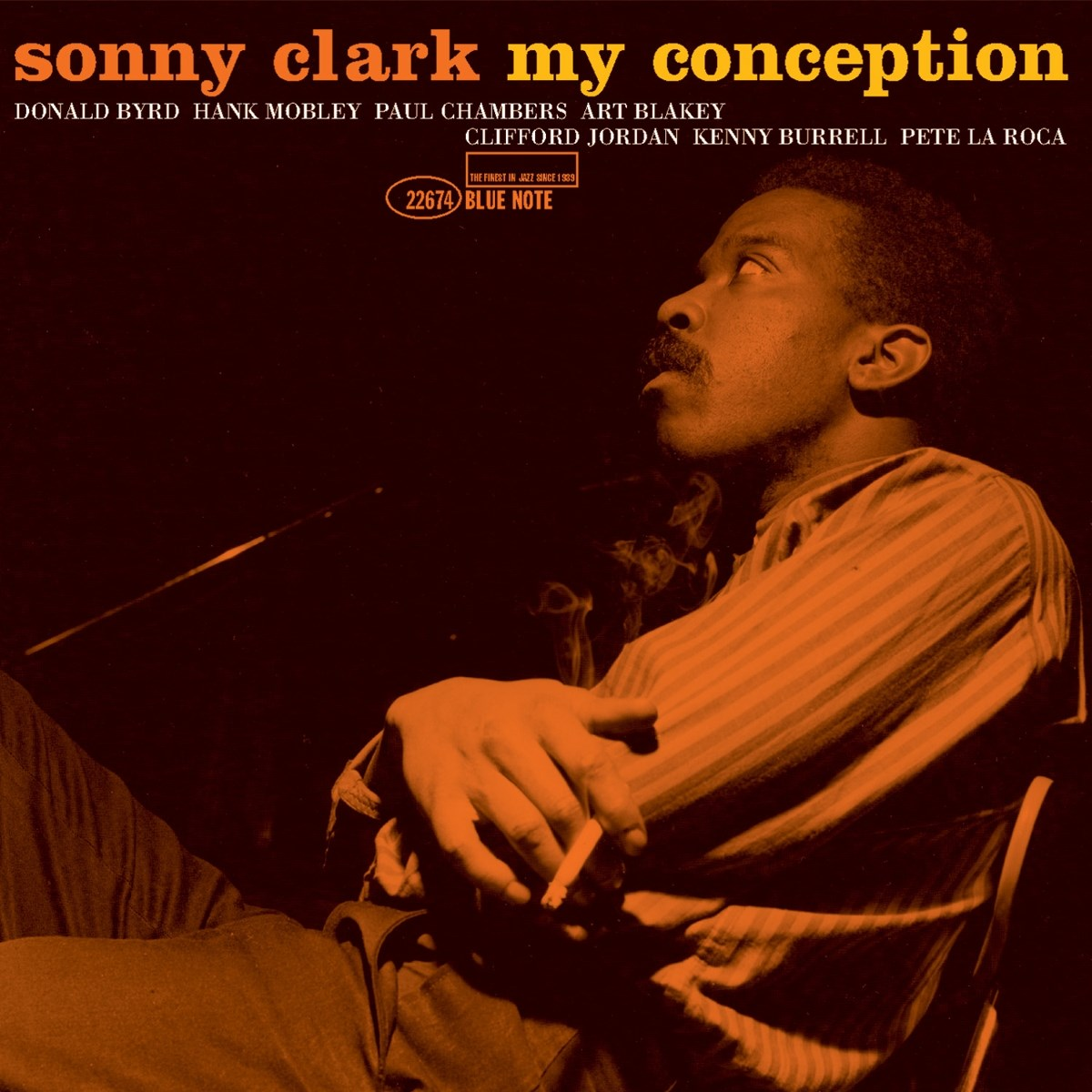 Copertina dell'album di Sonny Clark. Un uomo con i baffi fuma una sigaretta. I toni arancioni e neri dominano l'immagine.