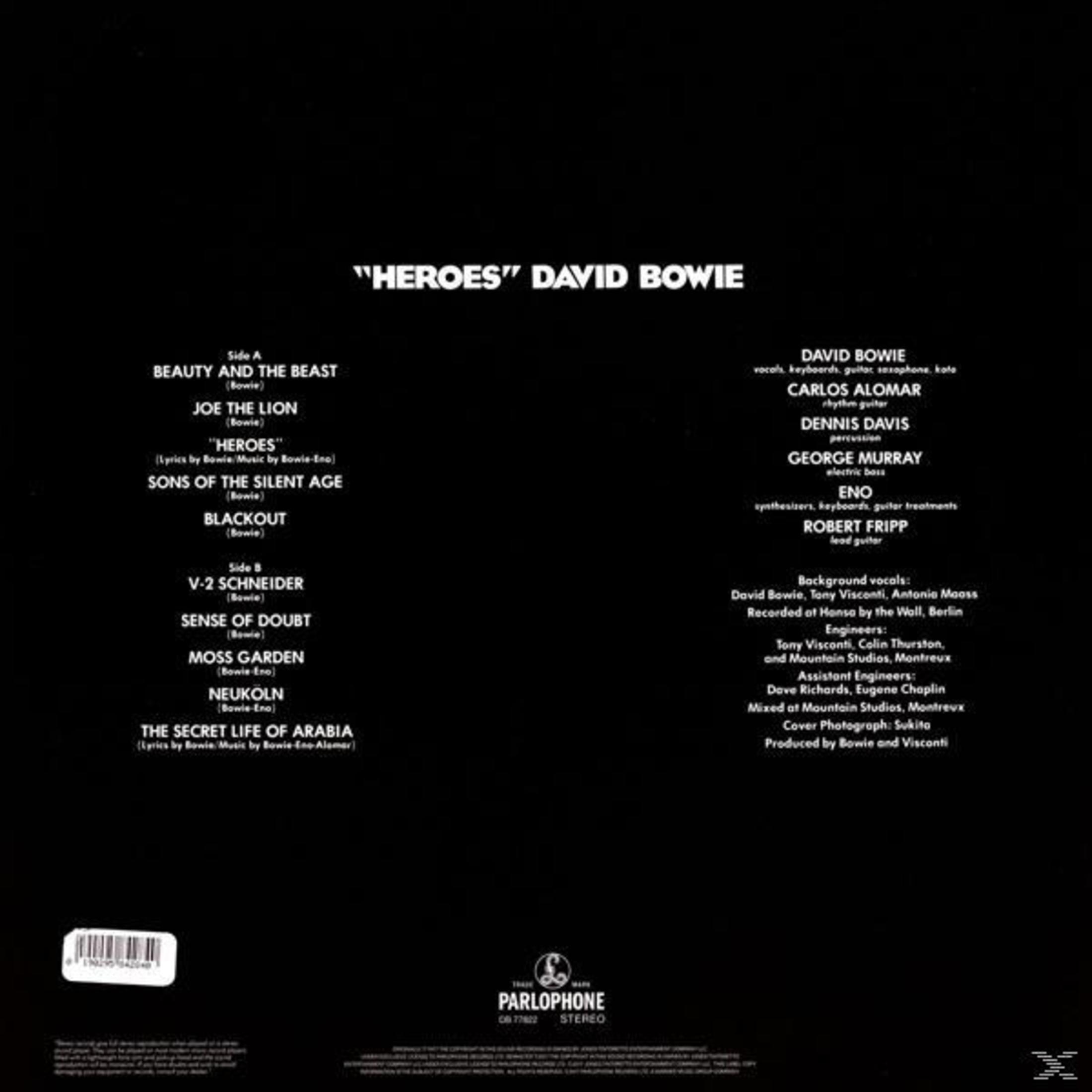 Portada del álbum "Heroes" de David Bowie. Presenta la lista de canciones, créditos y el logotipo de Parlophone sobre fondo negro.