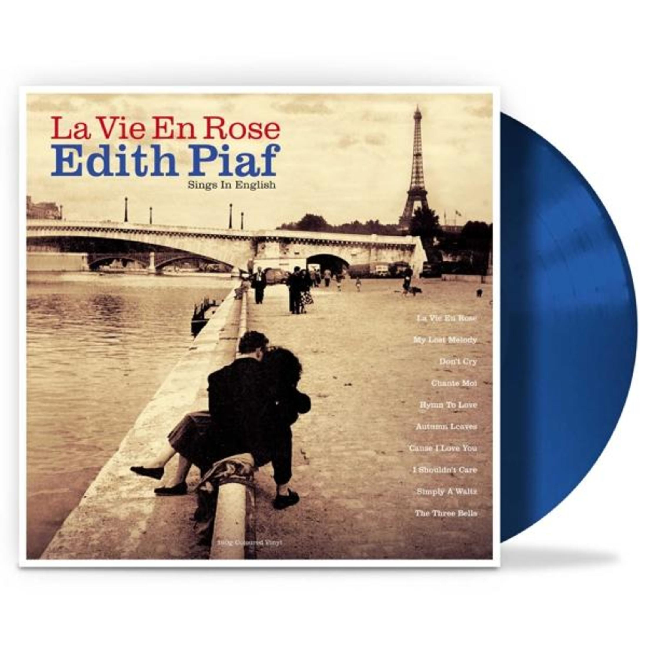Copertina dell'album di Edith Piaf, "La Vie En Rose". Scena di Parigi con la Torre Eiffel. Una coppia si abbraccia. Vinile blu.