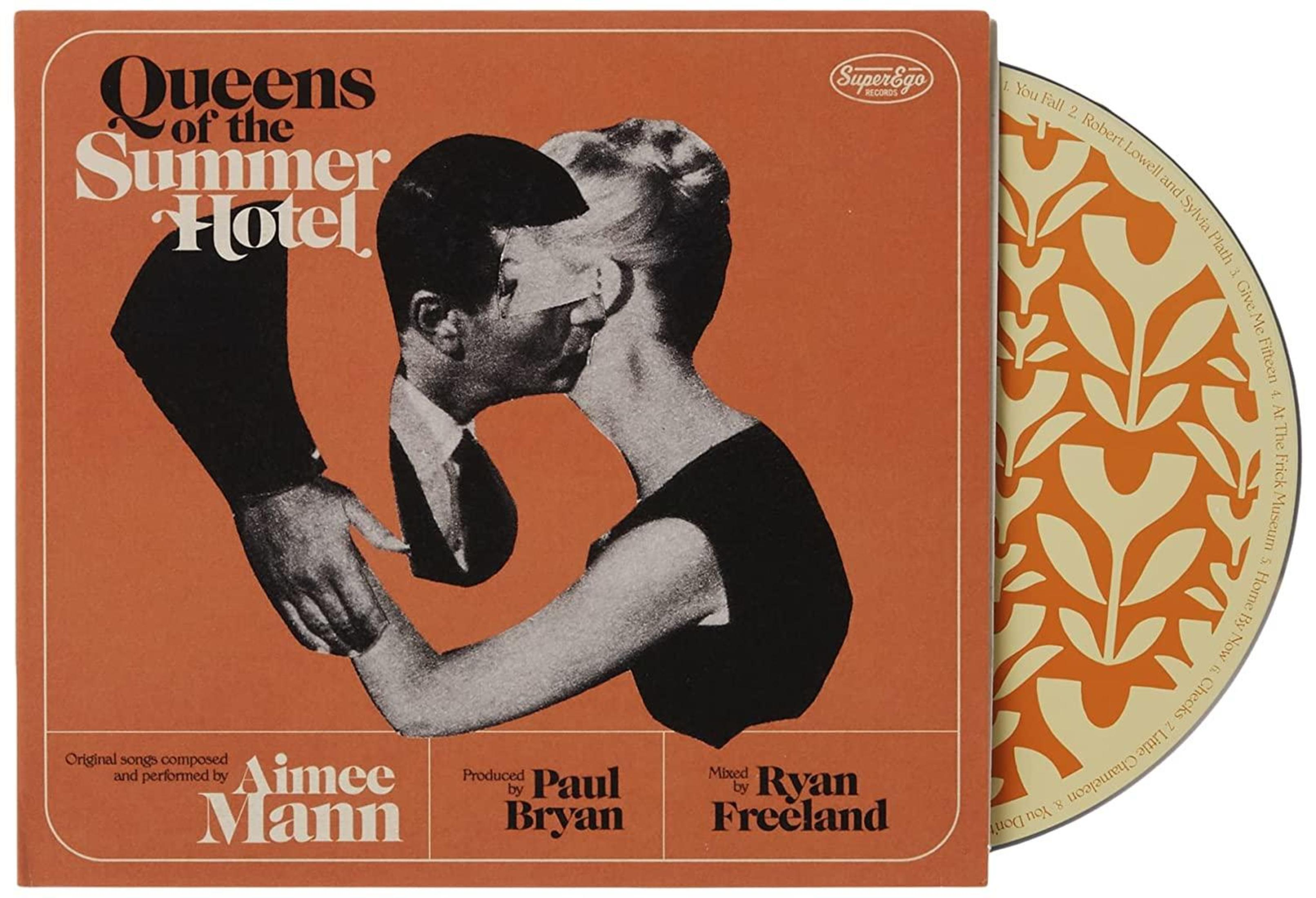 Albumhoes met zwart-wit afbeelding van twee kussende mensen. Oranje achtergrond met tekst. CD rechts zichtbaar.
