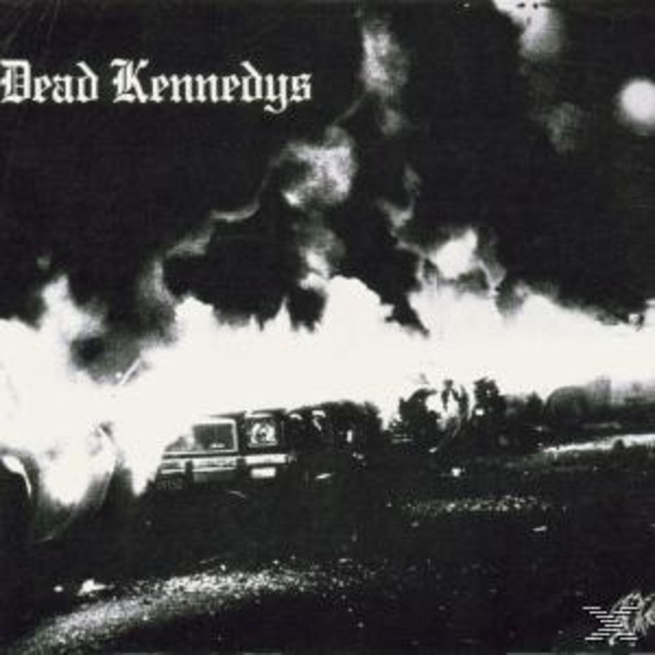Albumcover. Titel 'Dead Kennedys' in witte, gotische letter. Een brandende auto met een donkere lucht op de achtergrond.
