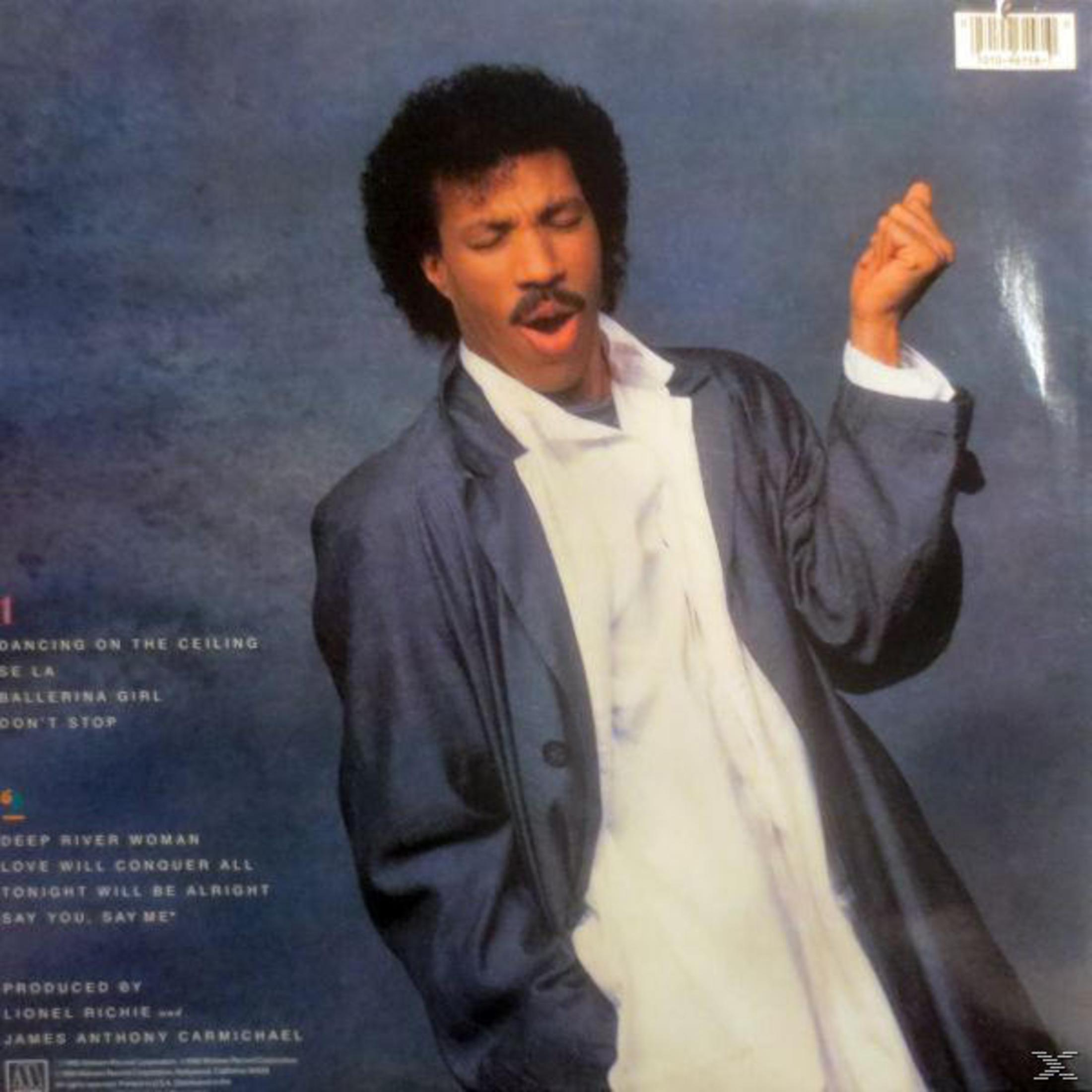 Copertina dell'album di Lionel Richie. È in giacca e cravatta, con una camicia bianca. Lo sfondo è blu e presenta le canzoni dell'album.