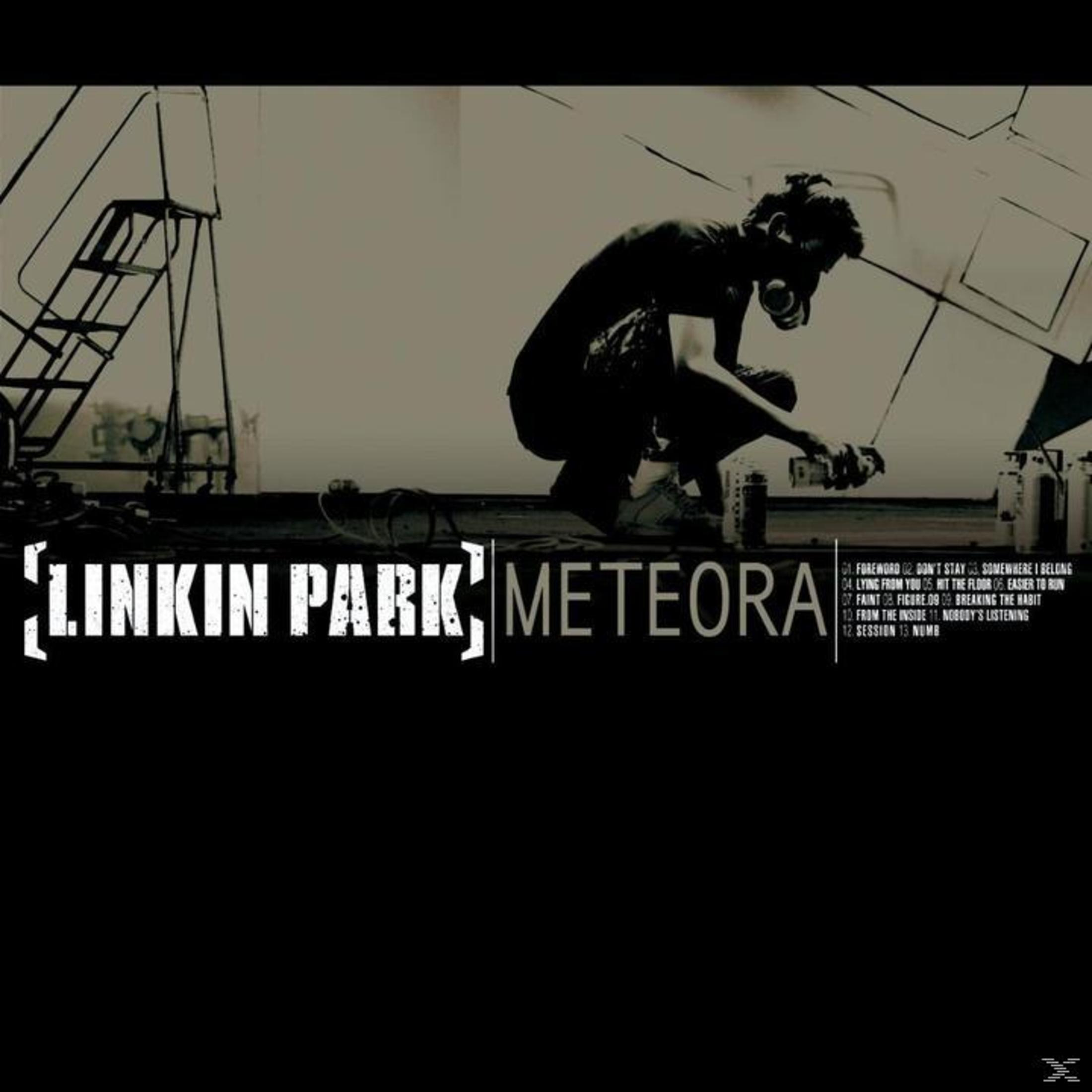 Albumhoes van Meteora van Linkin Park. Een persoon spuit verf met een masker. De tracklist van het album staat rechts.