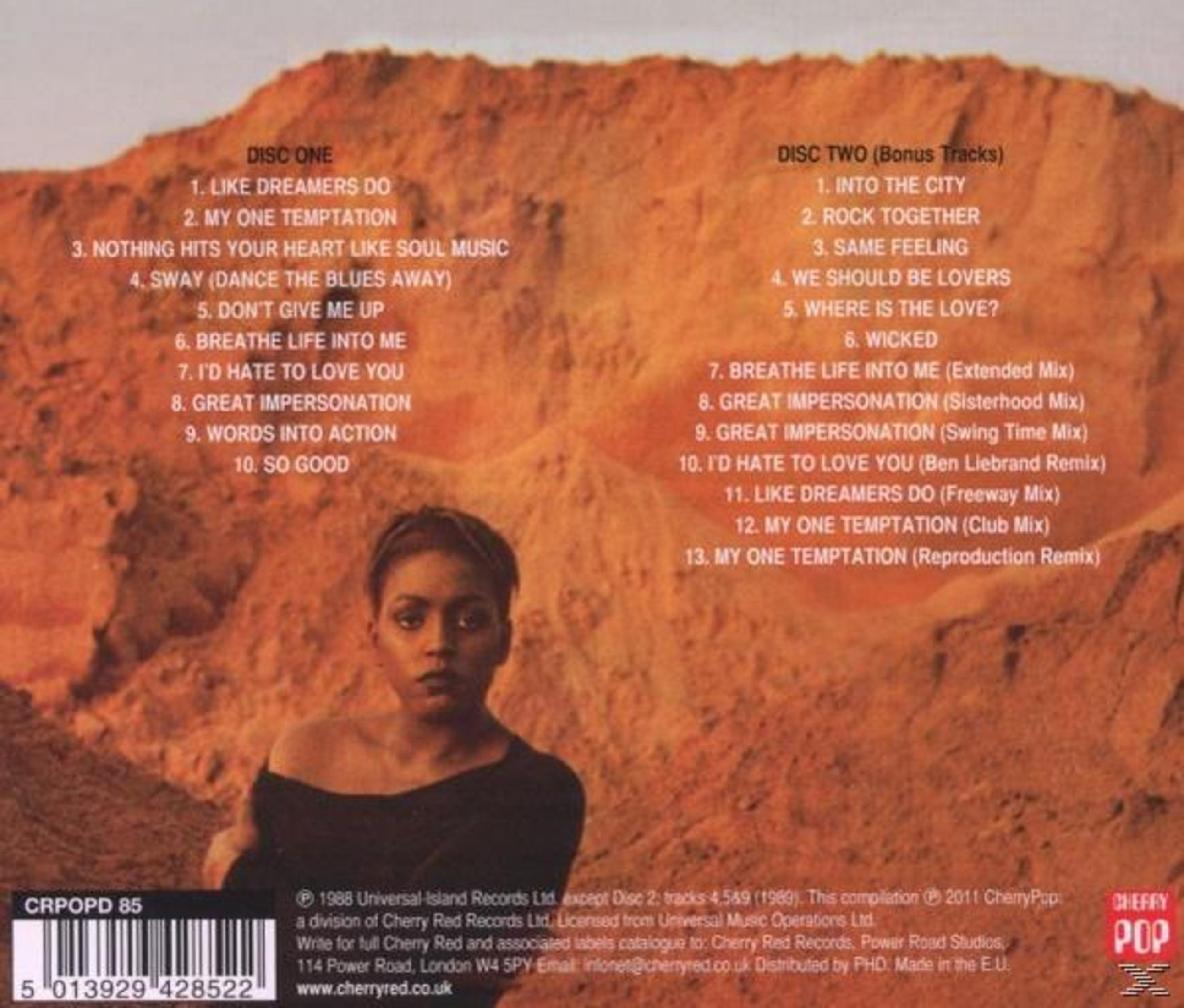 CD-hoes met portret van een vrouw en tracklijsten. De achtergrond is oranje. Er is tekst en een logo.