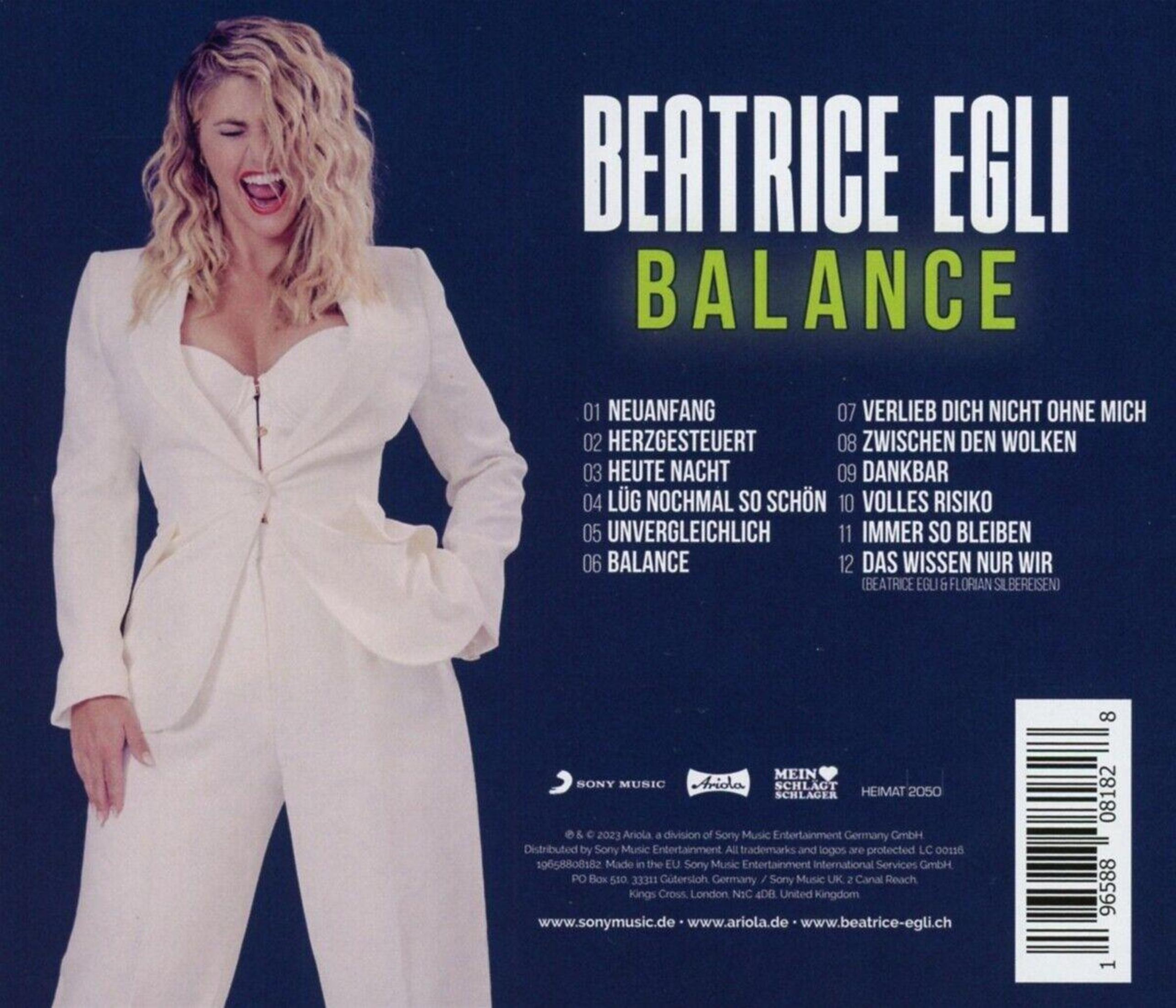 Albumcover von Beatrice Egli, betitelt 'Balance'. Zeigt eine Frau in Weiß, lächelnd. Text enthält Songtitel.