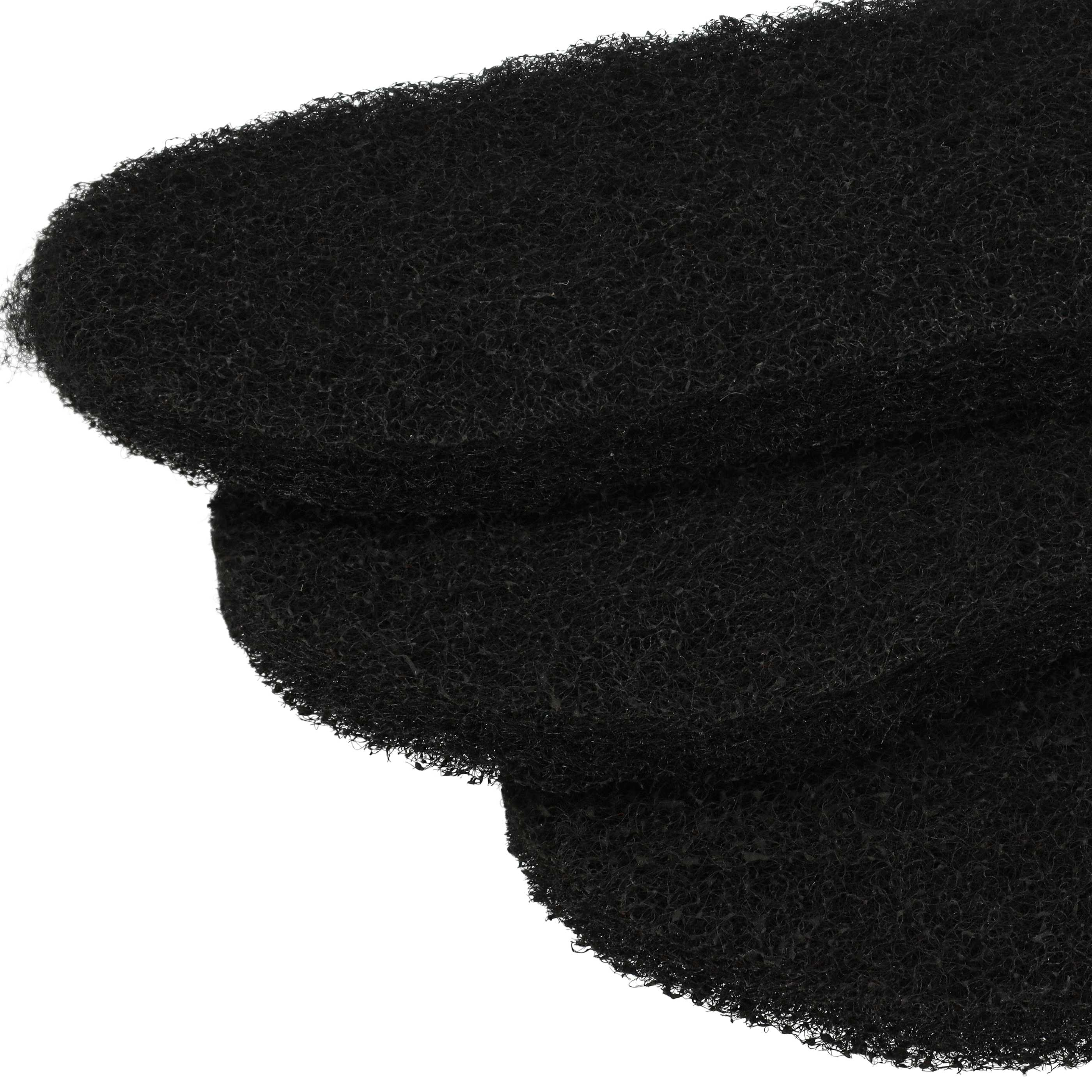 Drei schwarze, strukturierte, ovale Objekte sind gestapelt. Sie liegen vor einem weißen Hintergrund.