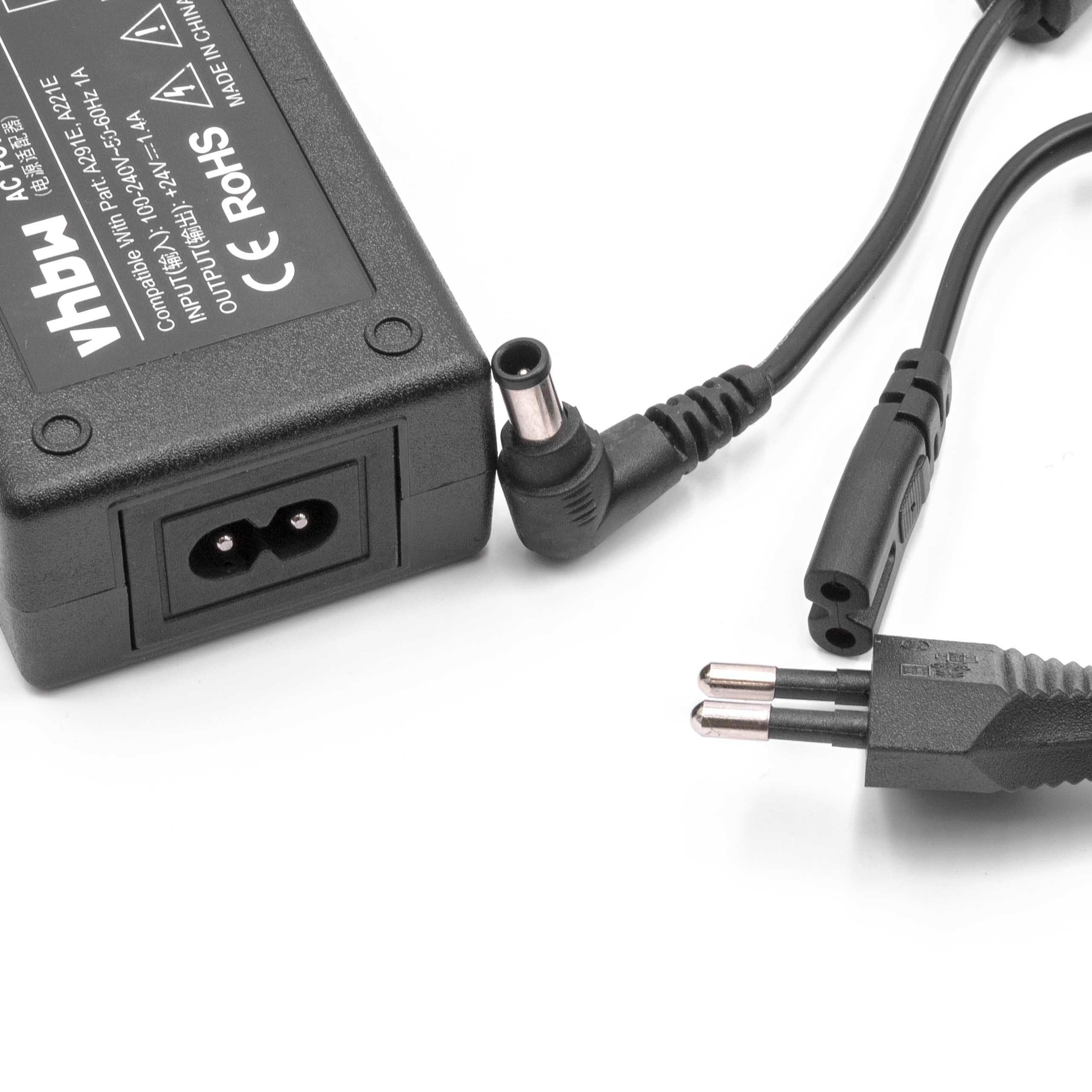 Ein schwarzes Netzteil mit einem zweipoligen Stecker und einem Hohlstecker. Der Adapter hat Text und ein CE-Zeichen.