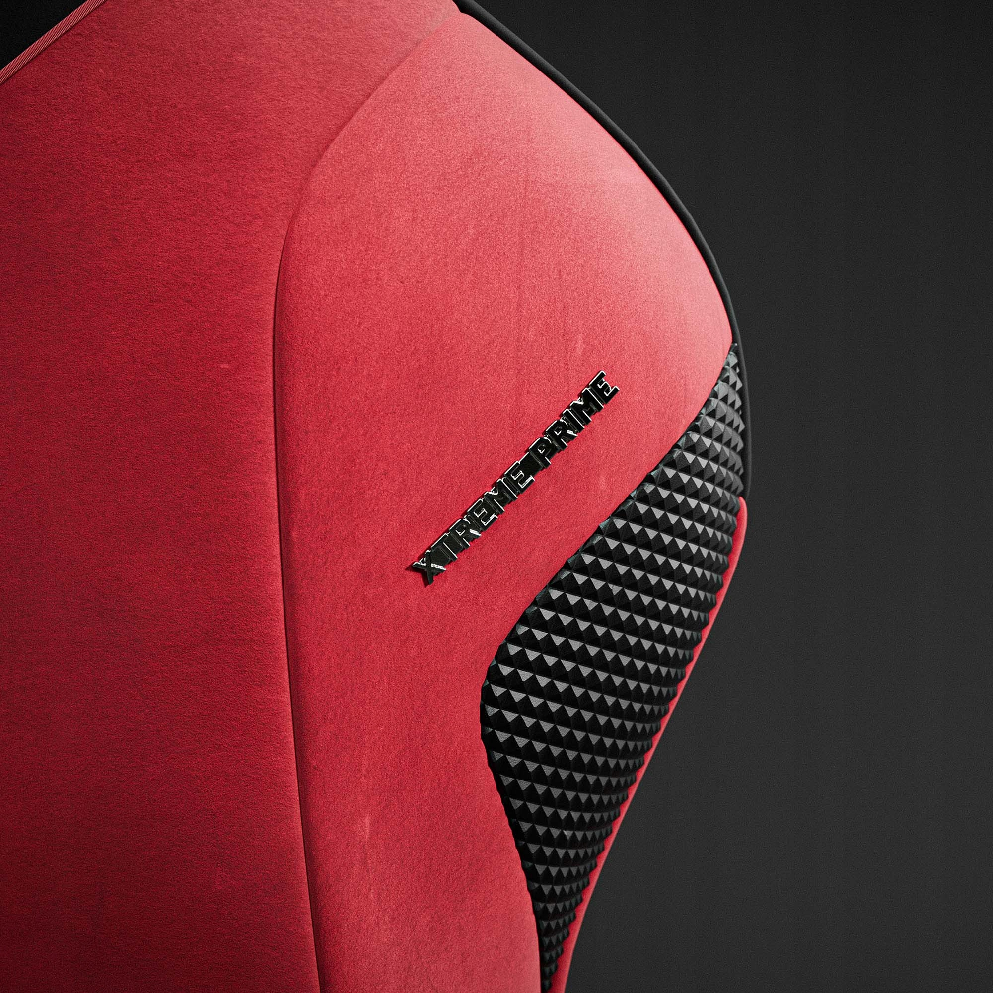 Zbliżenie czerwonej tkaniny z czarnym trójkątnym wzorem. Widoczne są czarne słowa XTREME PRIME.
