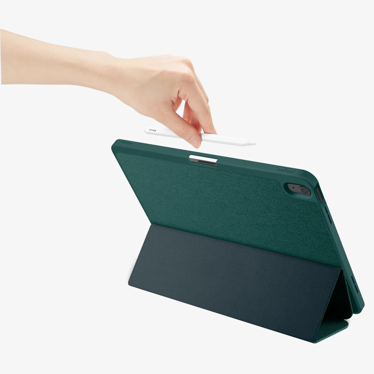 A hand holds a white stylus above a teal tablet case, which is propped open on a white surface.