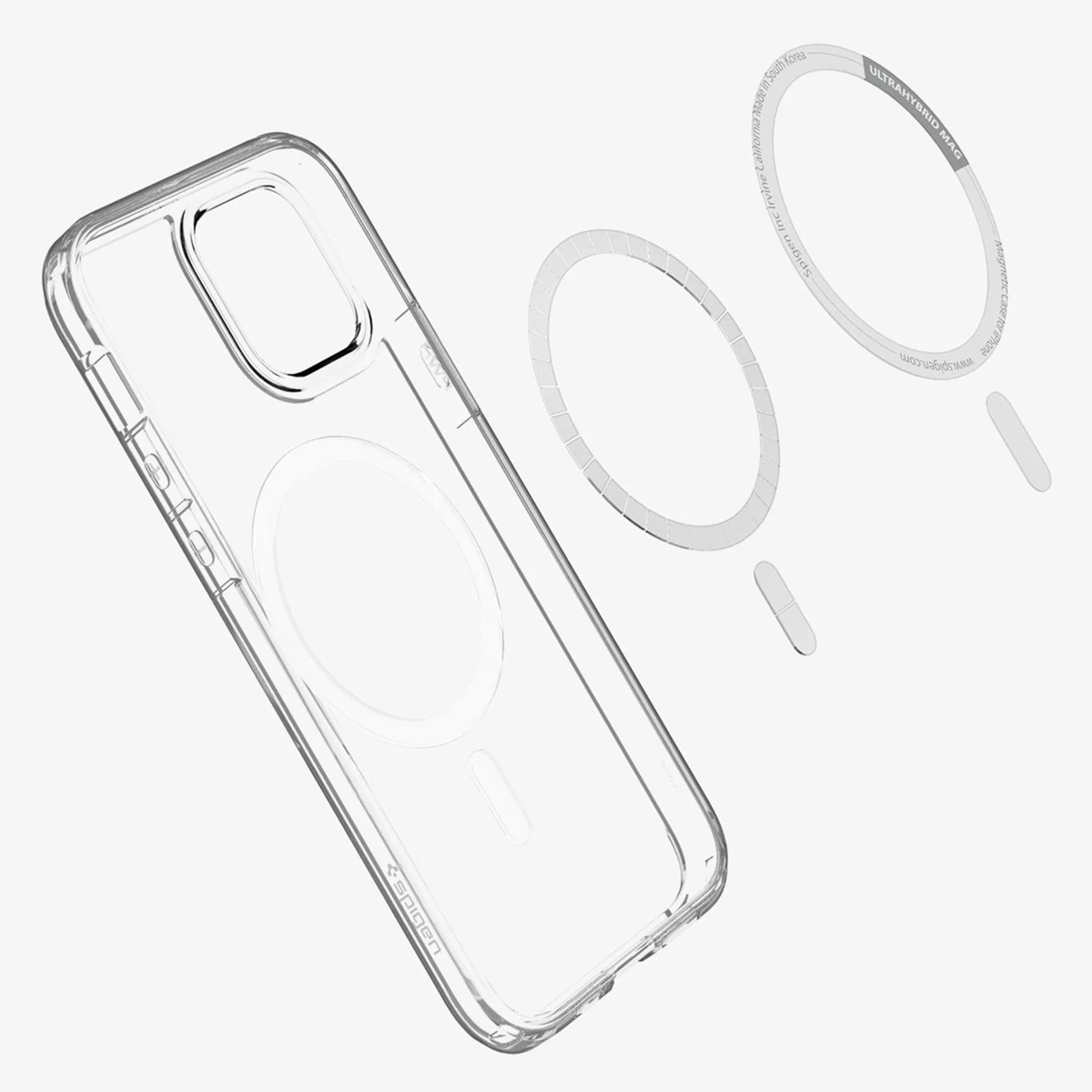 Transparante telefoonhoes en magnetische ringonderdelen. Merk Spigen. ULTRAHYBRID MAG-tekst zichtbaar. Witte achtergrond.