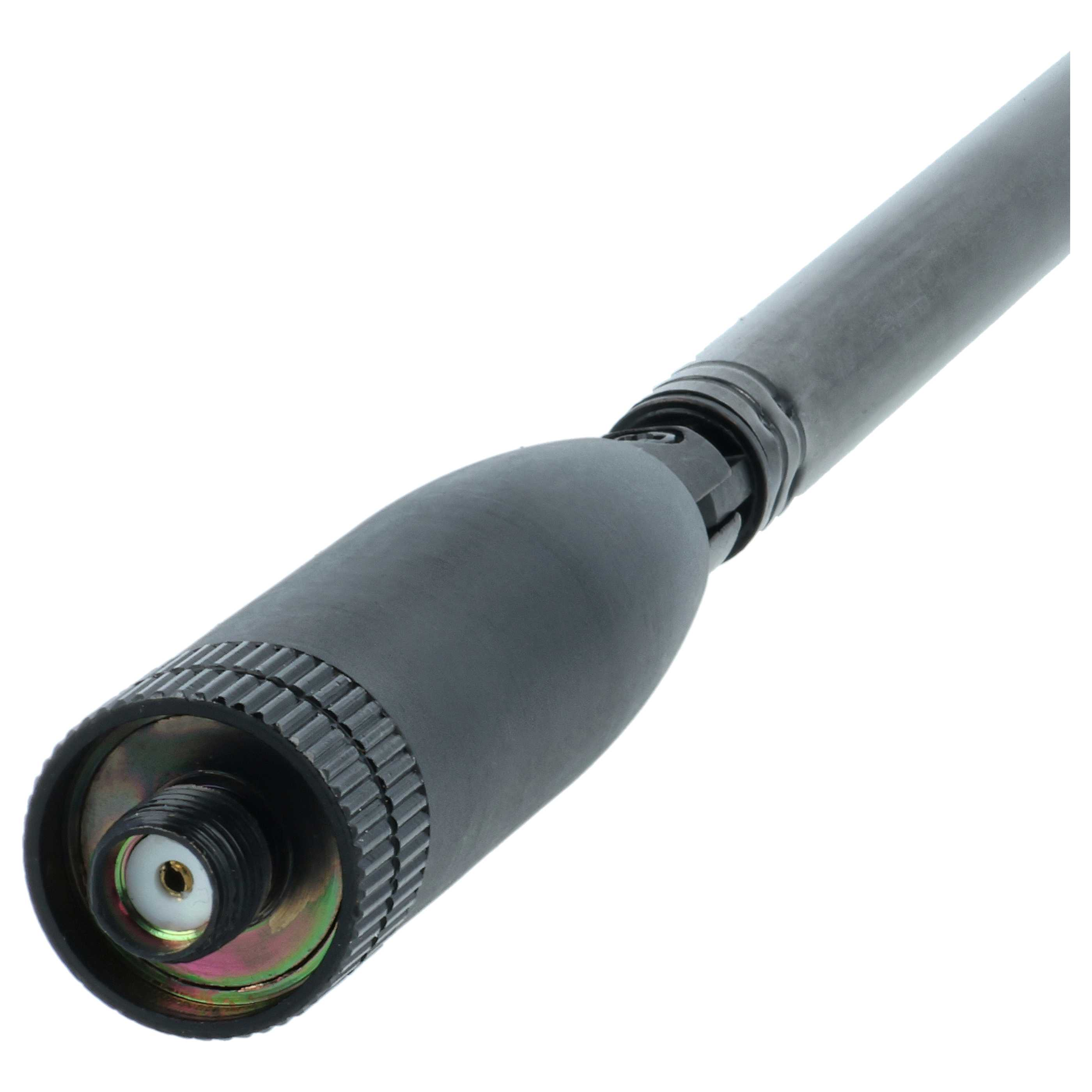 Eine schwarze Antenne mit gerillter Basis und zylindrischem Körper vor weißem Hintergrund.