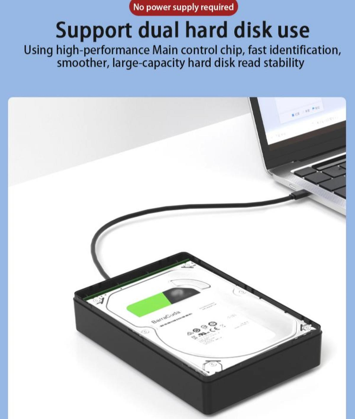 Eine Festplatte, die über ein USB-Kabel mit einem Laptop verbunden ist. Die Festplatte befindet sich in einem schwarzen Gehäuse und ist mit Barracuda beschriftet.