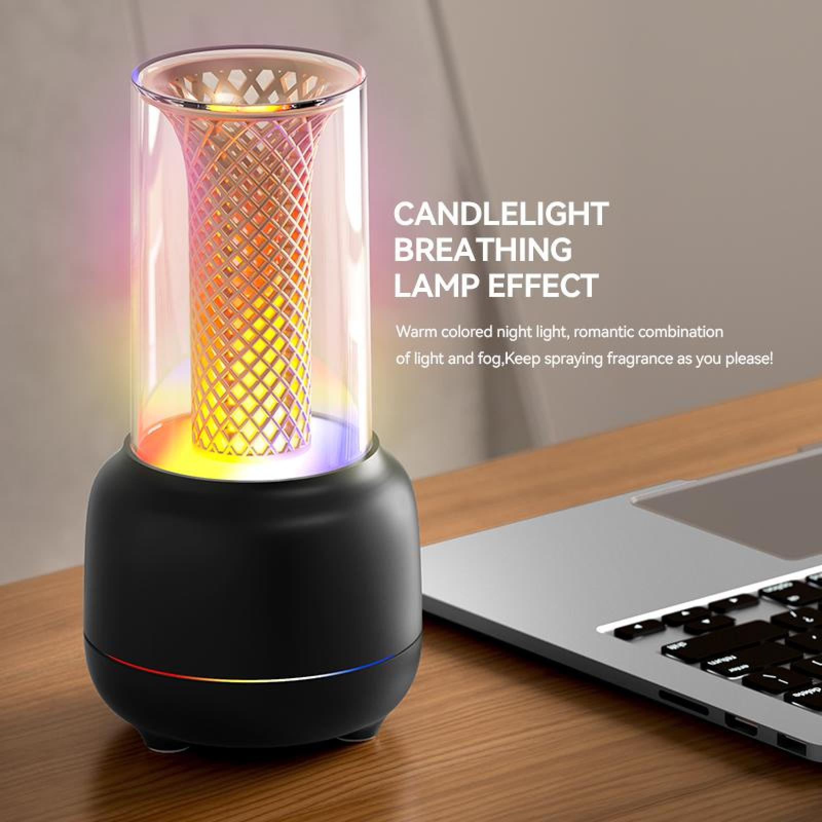 Eine schwarze Lampe mit bunten Lichtern, die auf einer Holzoberfläche neben einem Laptop steht.