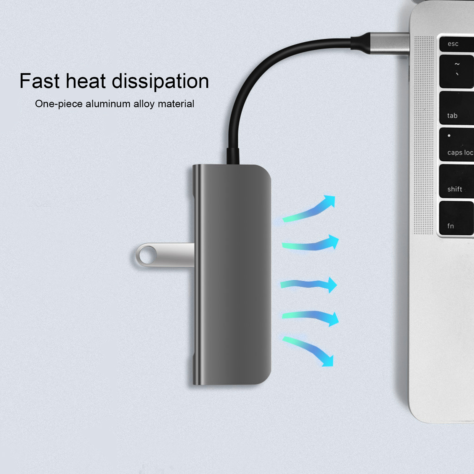Ein grauer USB-Hub, der mit einem Laptop verbunden ist. Der Text lautet: 'Schnelle Wärmeableitung'.