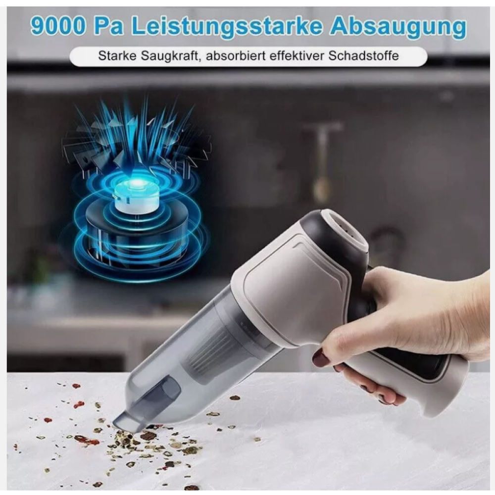 Eine Person benutzt einen Handstaubsauger, um Schmutz von einer Oberfläche zu entfernen. Der Staubsauger ist grau und weiß, und der Hintergrund ist verschwommen.