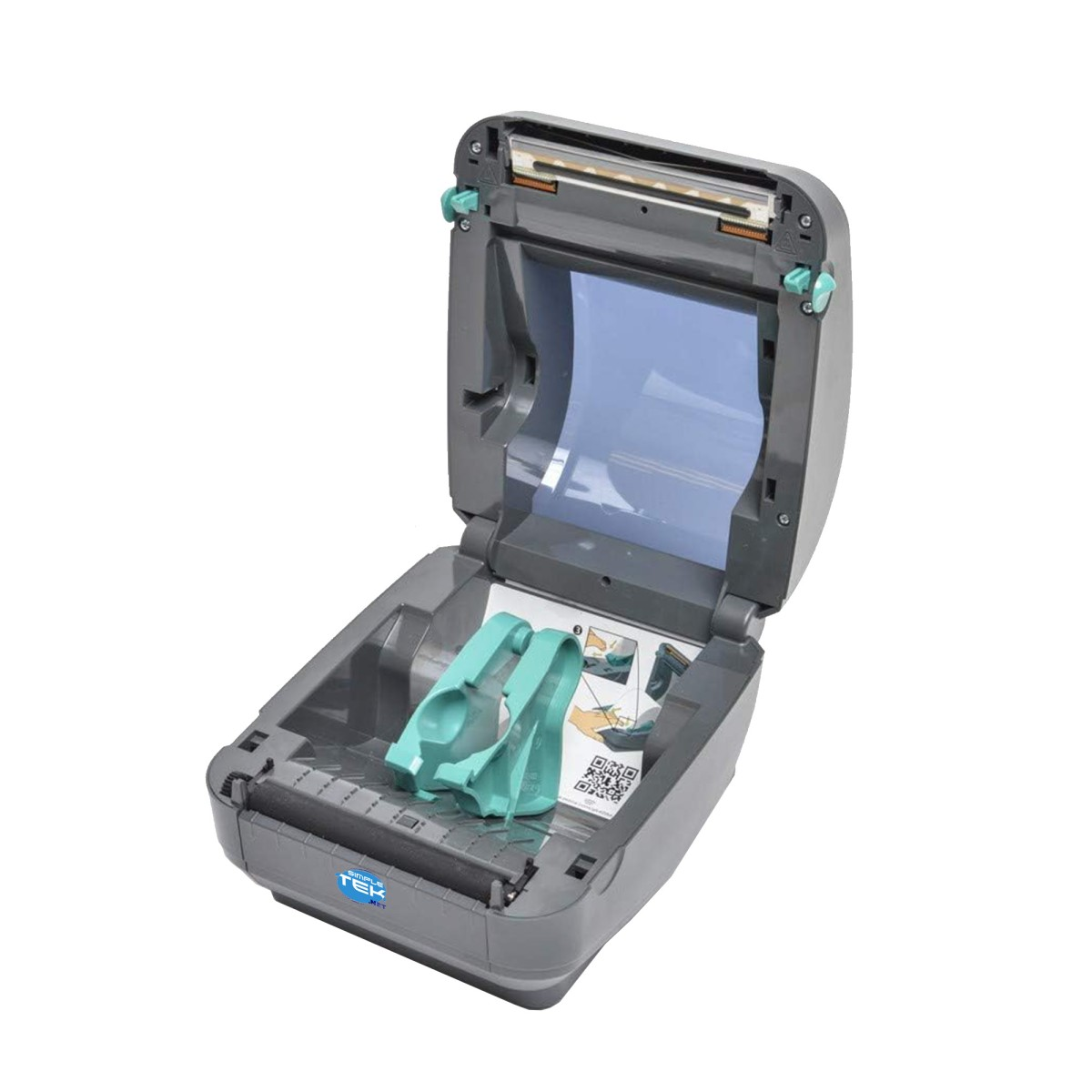 Otwarty szary skaner z przezroczystą niebieską powierzchnią w środku. W środku znajdują się dwa turkusowe klipsy z papierem z kodem QR.