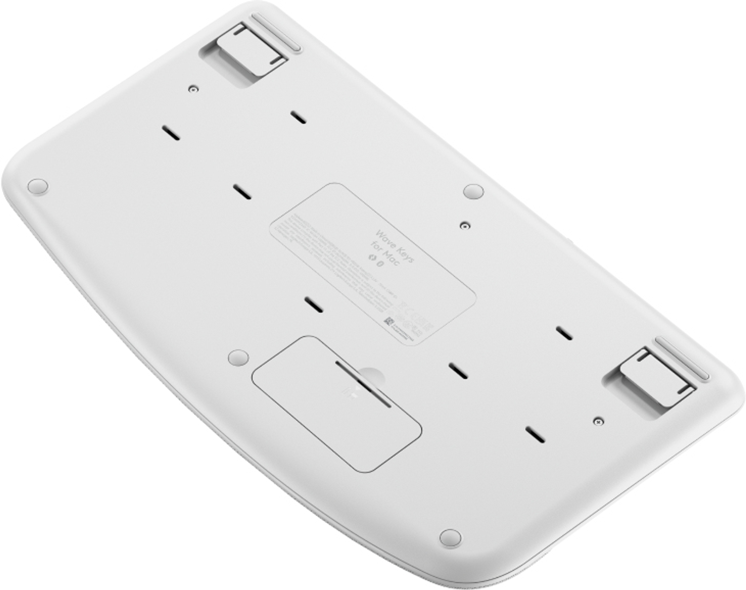 Spód białej klawiatury, z napisem 'Wave Keys for Mac'. Posiada regulowane nóżki, otwory na śruby i komorę na baterie.