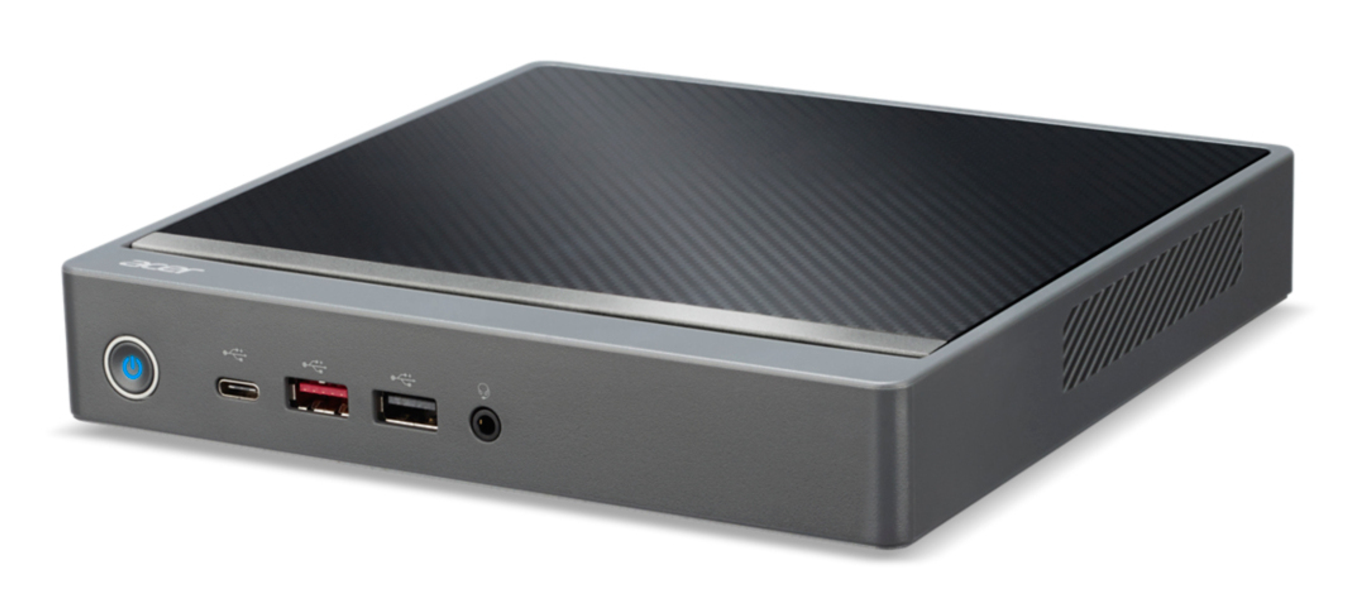 Un computer Acer compatto. Ha un corpo grigio con una parte superiore nera strutturata. La parte anteriore ha porte, tra cui USB e audio.
