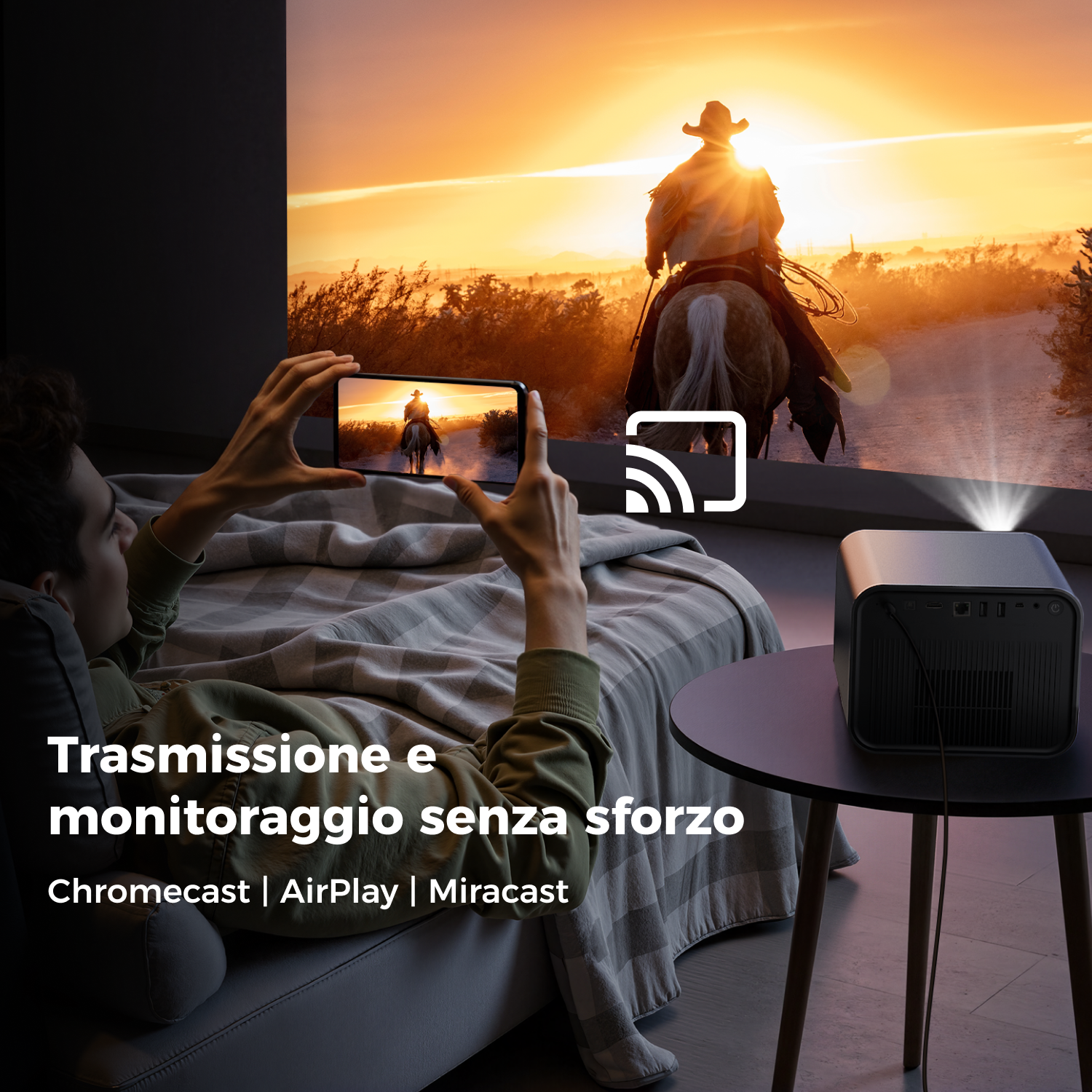 A person watches a cowboy riding a horse on a screen. A projector sits on a table. The scene is at sunset with text.