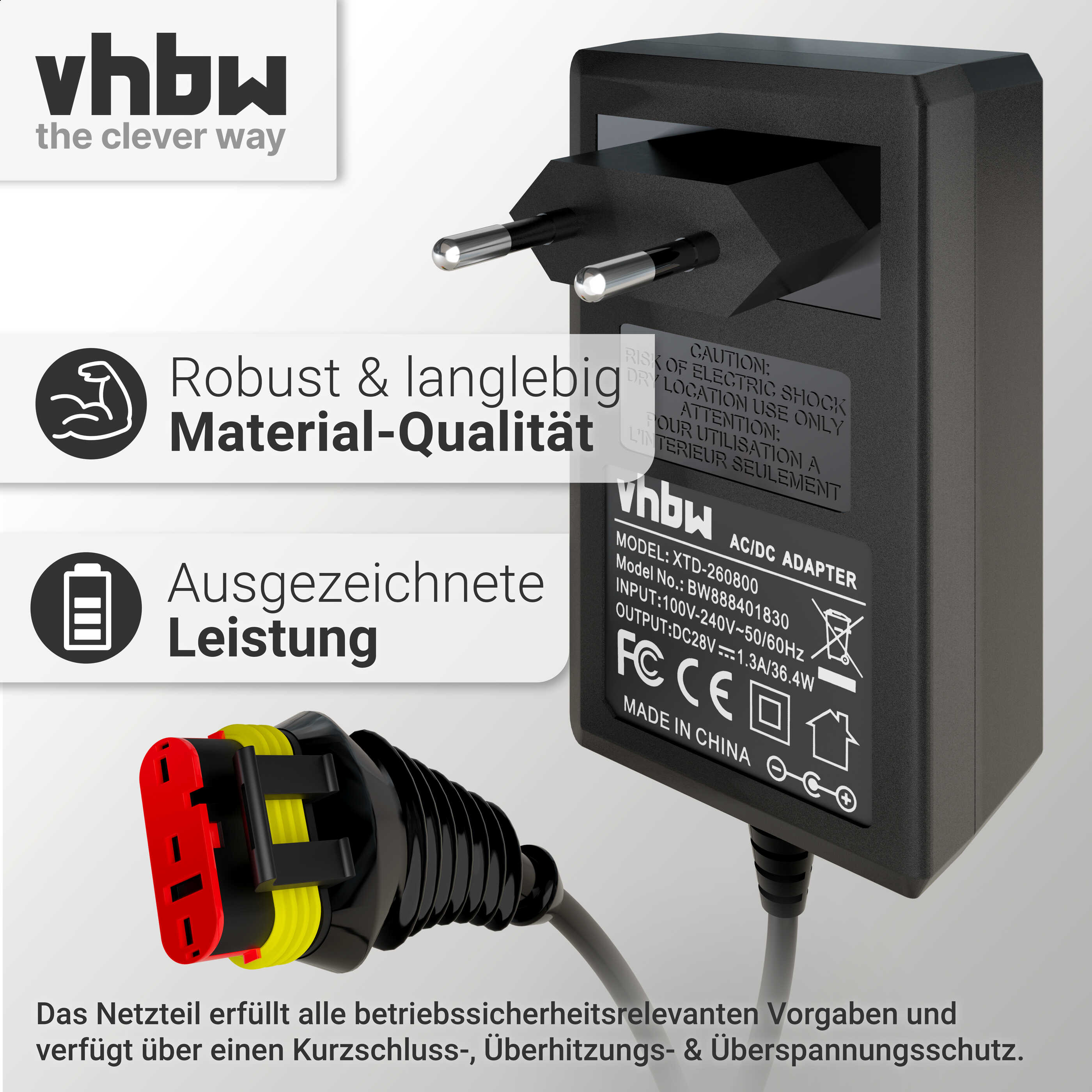 Ein AC/DC-Adapter mit Stecker. Text auf dem Adapter lautet: Robust, Materialqualität und Hervorragende Leistung.