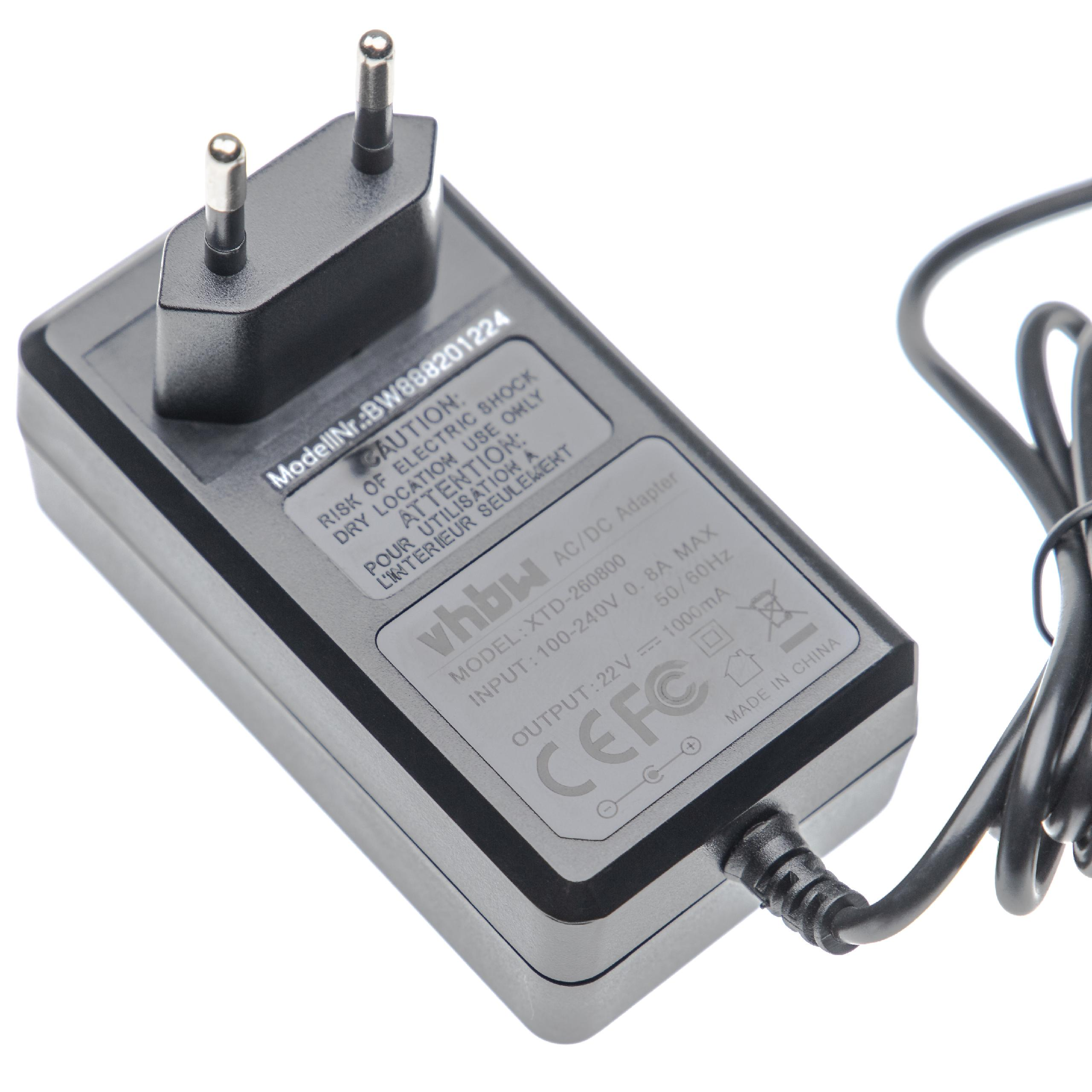 Ein schwarzer AC/DC-Adapter mit einem zweipoligen Stecker, einem schwarzen Kabel und weißem Text auf der Oberfläche, vor weißem Hintergrund.