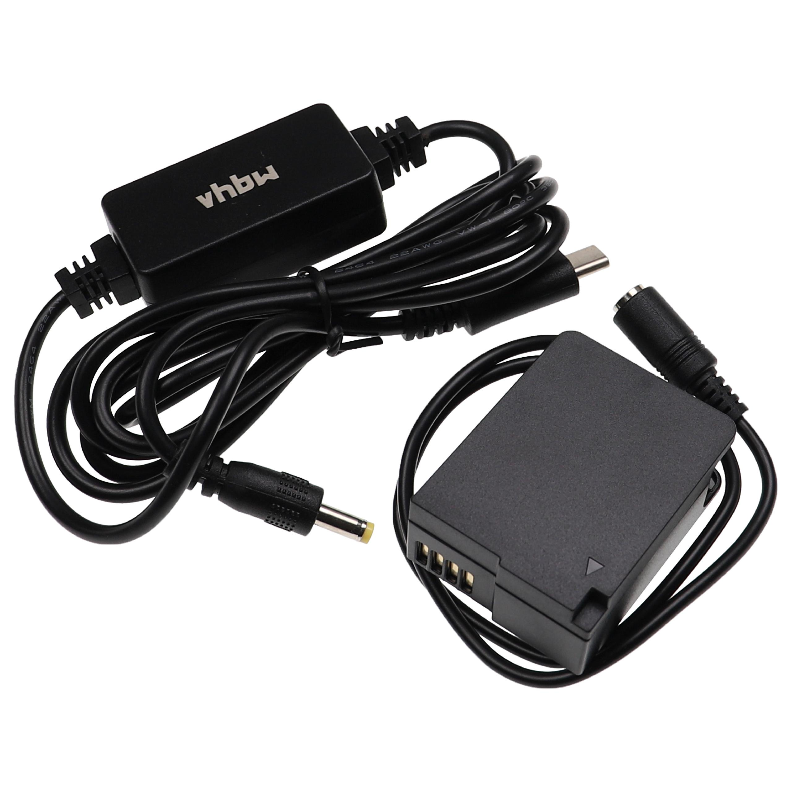 Schwarzes Kamera-Netzteil mit Kabeln und einer batterieähnlichen Komponente. Enthält USB-C und andere Anschlüsse. Weißer Hintergrund.
