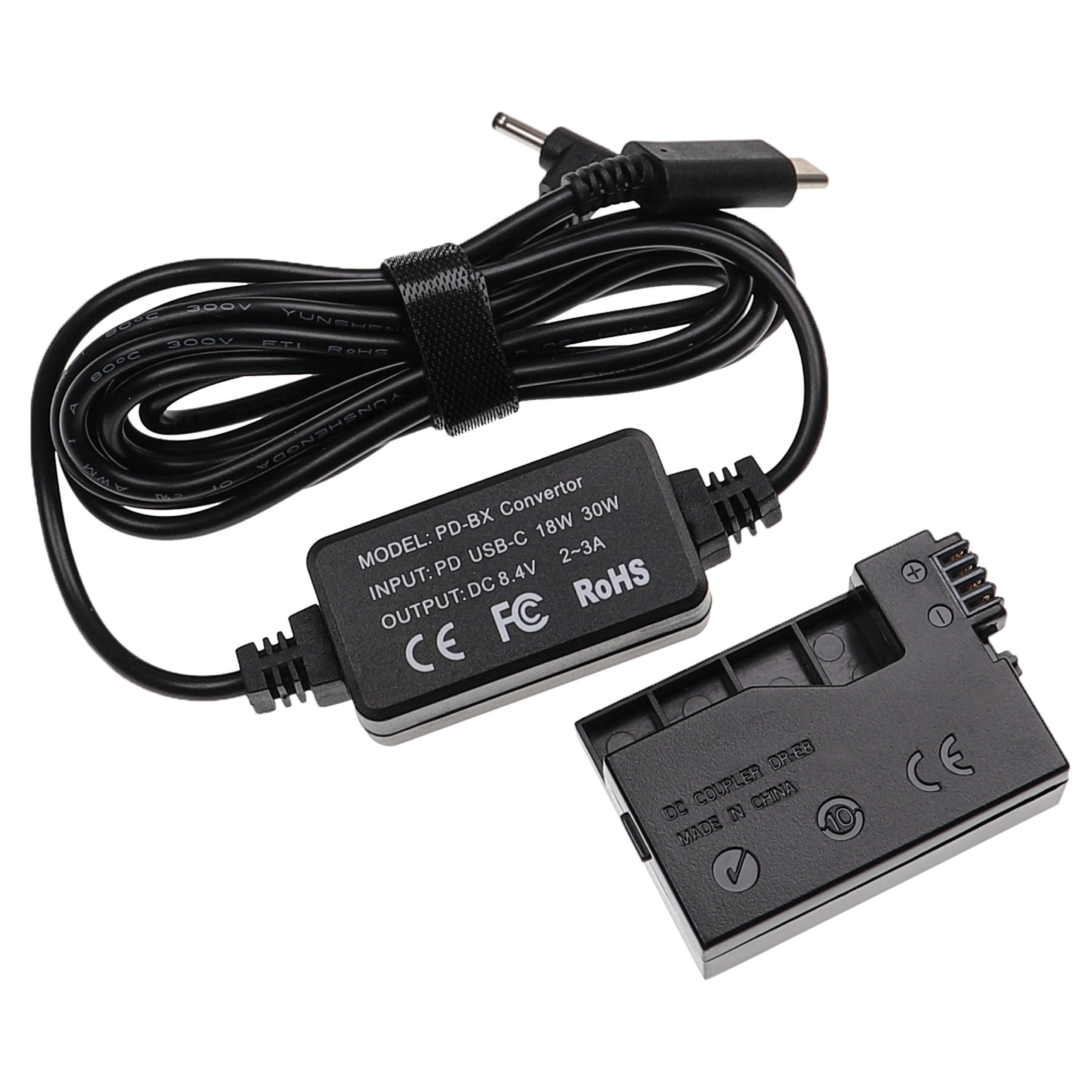 Ein schwarzer PD-BX-Konverter mit USB-C- und DC-Anschlüssen und ein schwarzer DC-Koppler auf weißem Hintergrund.