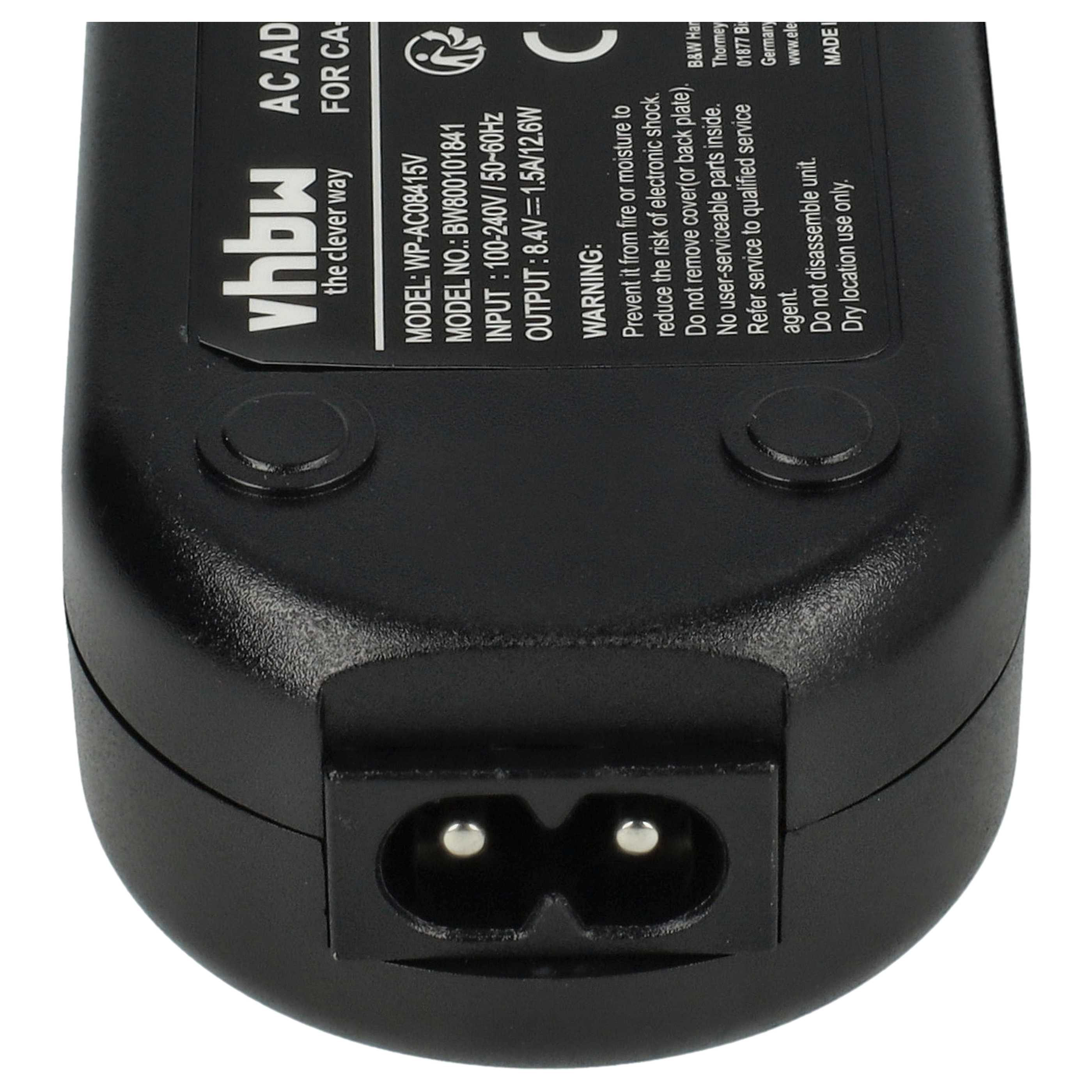 Schwarzer Netzadapter. Merkmale: Beschriftungen mit Text, ein Stromanschluss und zwei runde Knöpfe.
