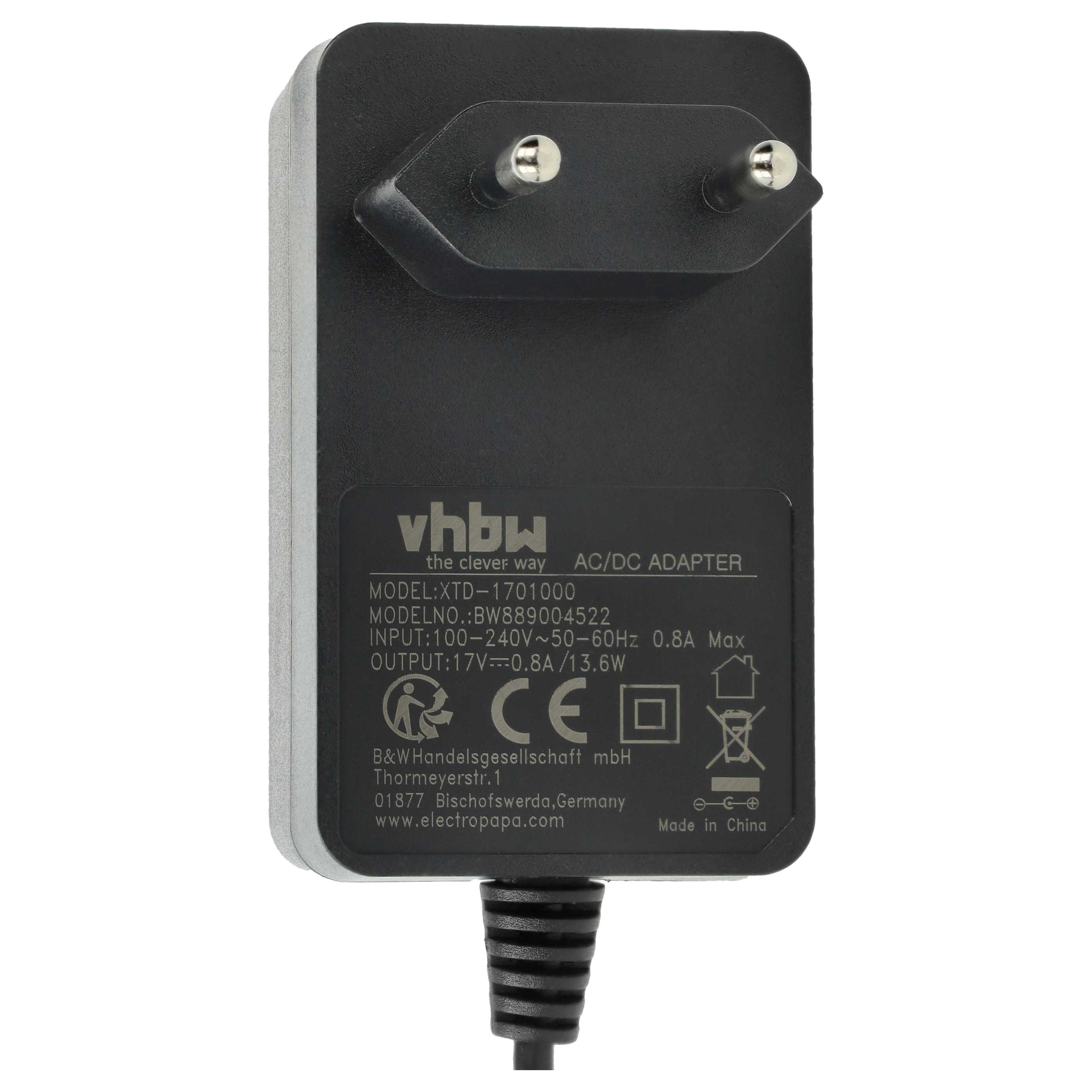Ein AC/DC-Adapter mit Stecker, schwarzem Gehäuse und weißem Etikett mit Text, einschließlich Markenname und technischen Details.