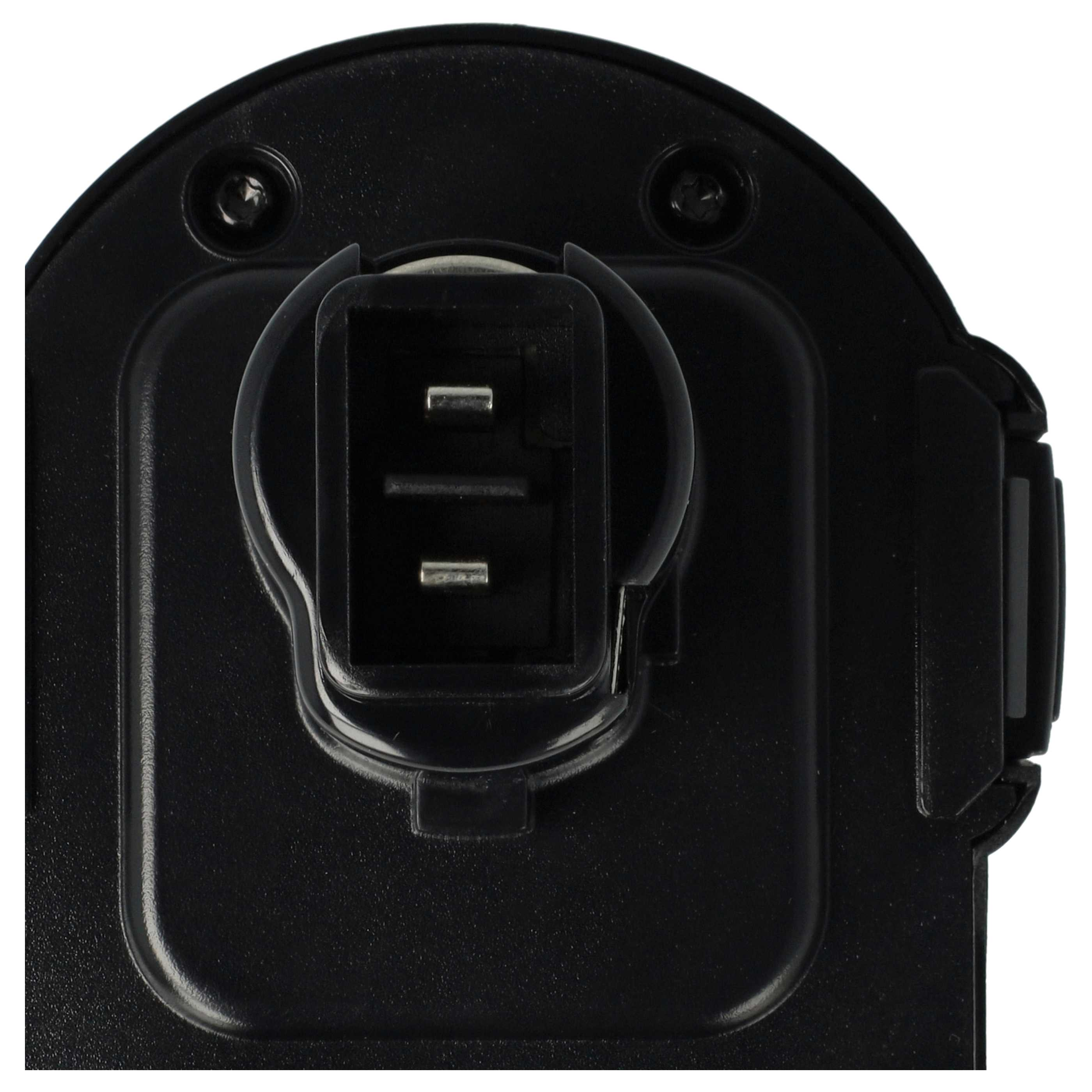 Nahaufnahme einer schwarzen Kunststoffkomponente, mit einem rechteckigen Stecker mit zwei Metallstiften und einem runden Körper.