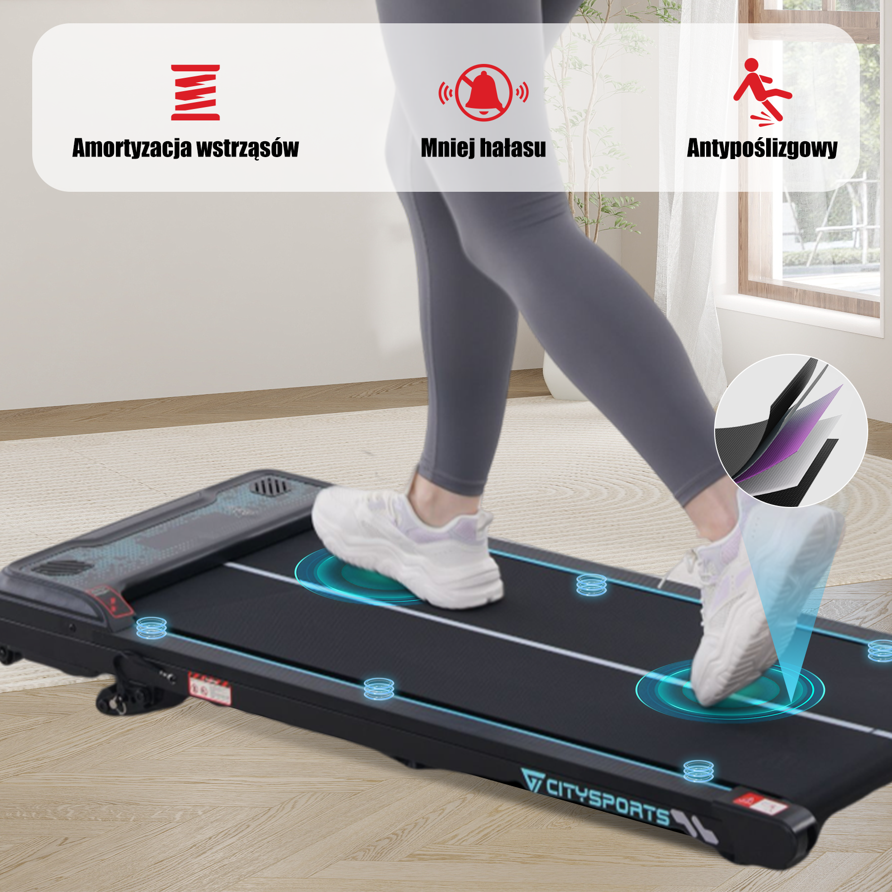 Osoba chodzi po bieżni. Bieżnia jest czarna z niebieskimi akcentami. Tekst opisuje funkcje takie jak amortyzacja i antypoślizgowość.