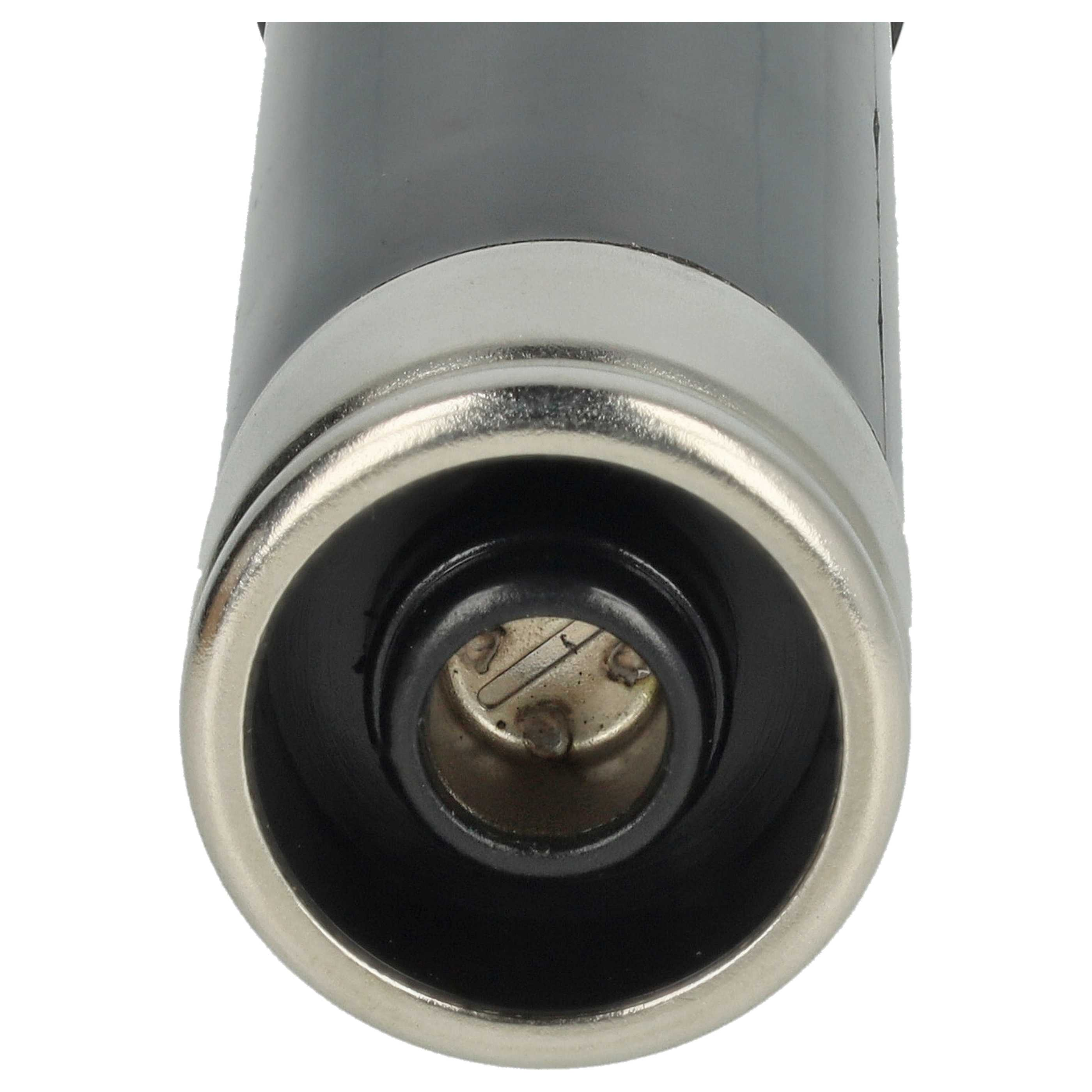 Nahaufnahme eines Zigarettenanzünders, schwarz und silber, mit Metallring und Loch.