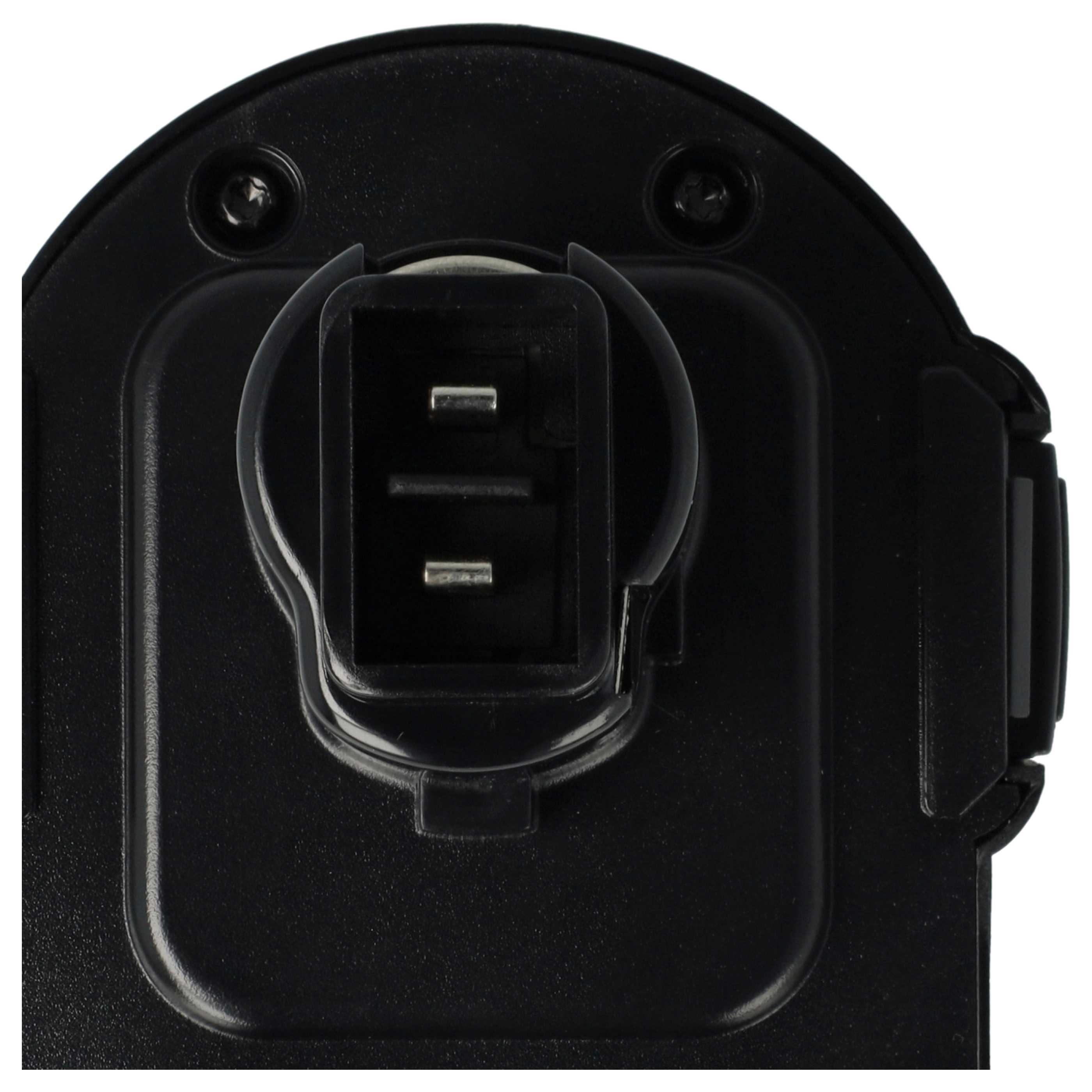 Nahaufnahme einer schwarzen elektrischen Komponente mit rechteckigem Stecker. Zwei Metallstifte sind sichtbar.
