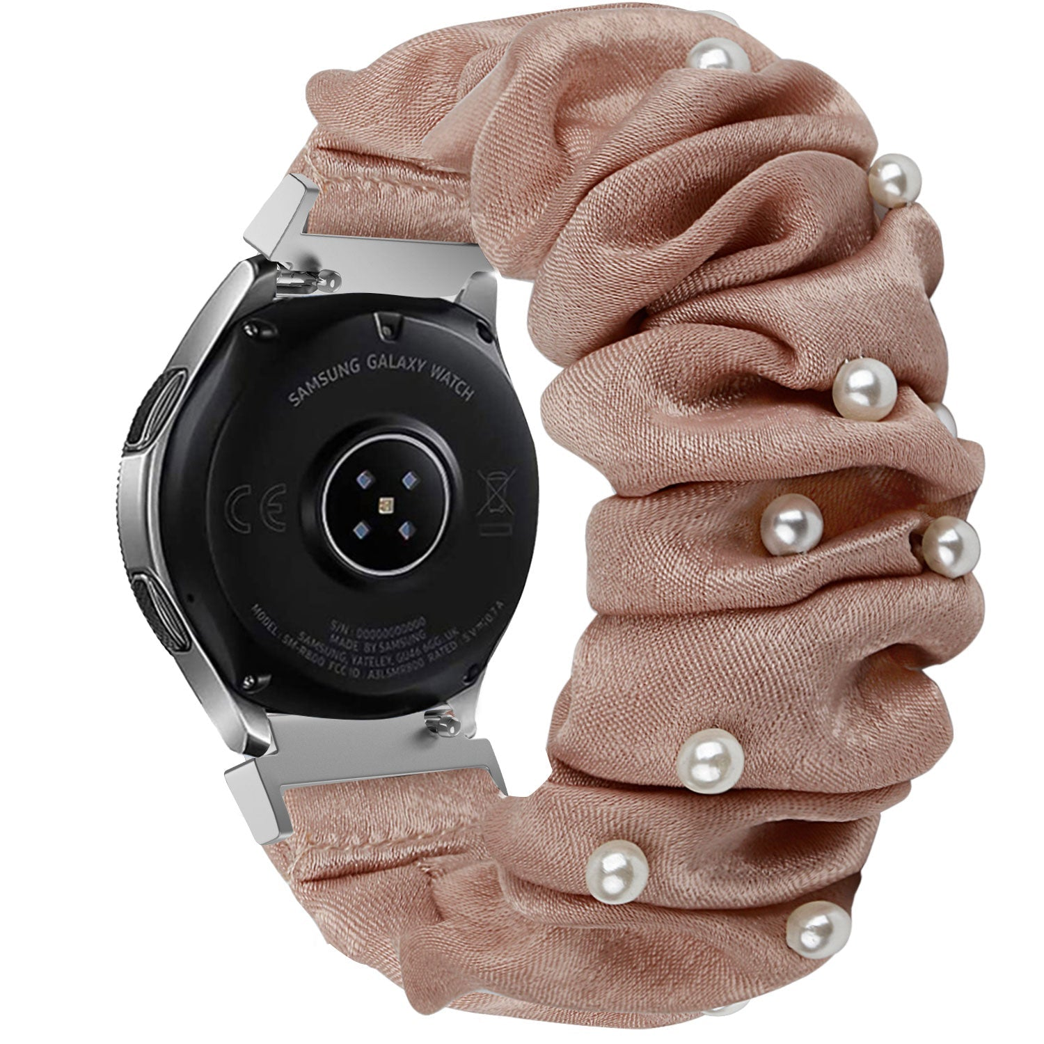 Eine Samsung Galaxy Watch mit einem blushfarbenen Scrunchie-Band, das mit Perlen verziert ist. Die Uhr ist schwarz, das Band ist gerafft und die Perlen sind weiß.