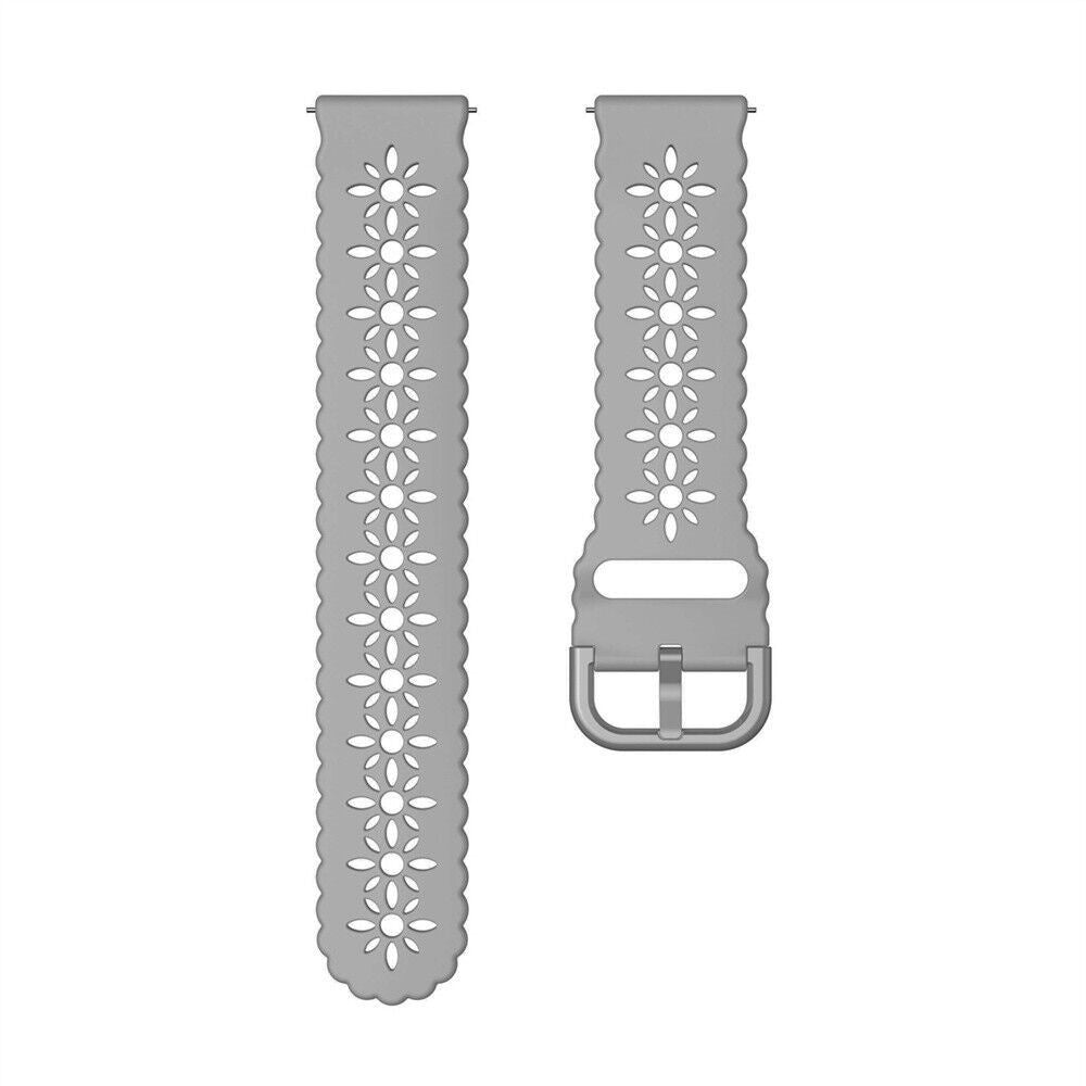 Zwei graue Uhrenarmbänder. Jeder Riemen hat ein Blumenmuster und eine Schnalle. Beide Riemen befinden sich auf weißem Hintergrund.