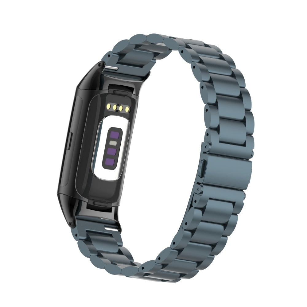 Ein graues Metallarmband mit einer schwarzen Smartwatch. Das Zifferblatt ist weiß mit einem lila Display. Das Armband ist metallisch und gebogen.