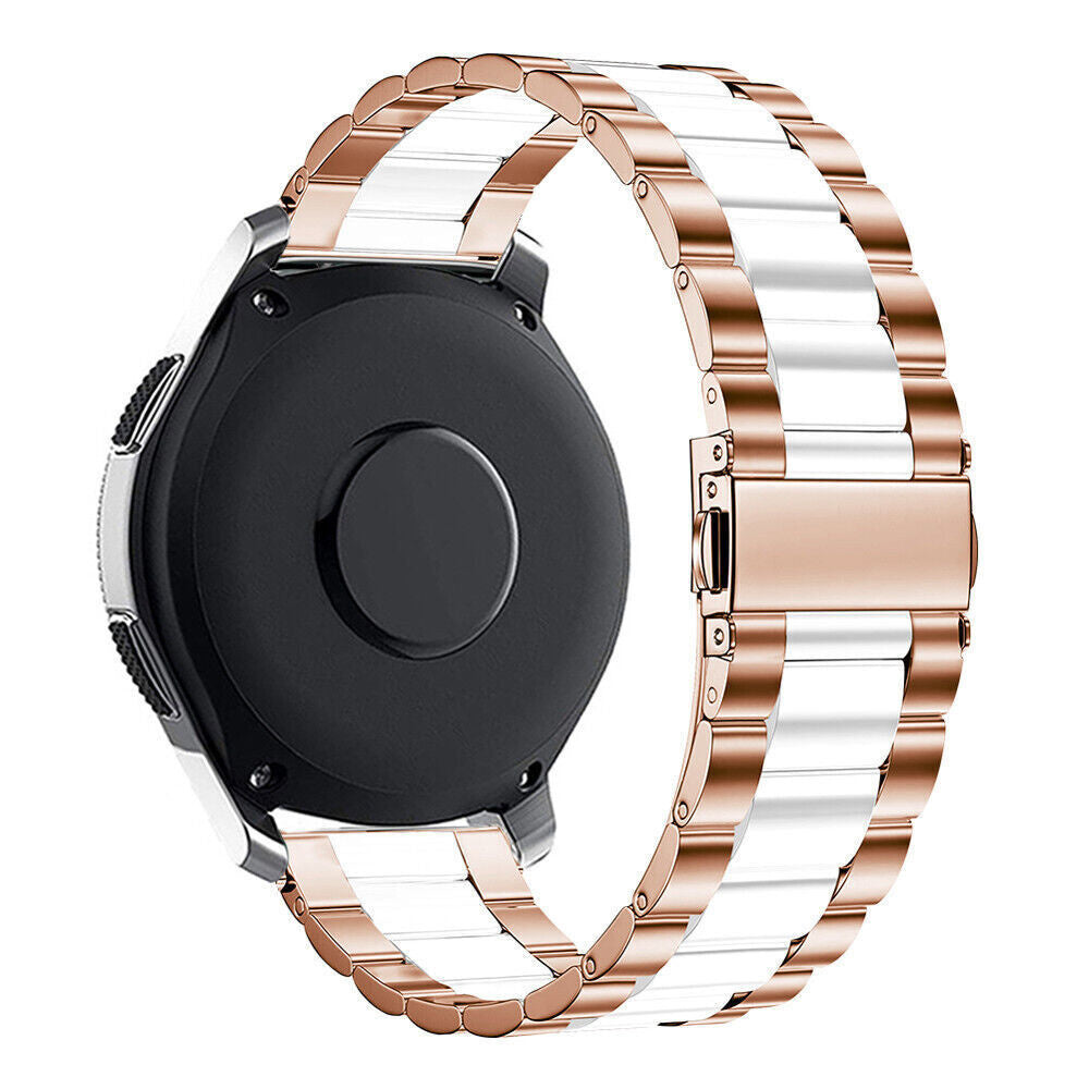 Gezeigt wird eine Smartwatch mit einem roségoldenen und weißen Armband. Die Uhr ist schwarz, das Armband ist weiß und roségoldfarben.