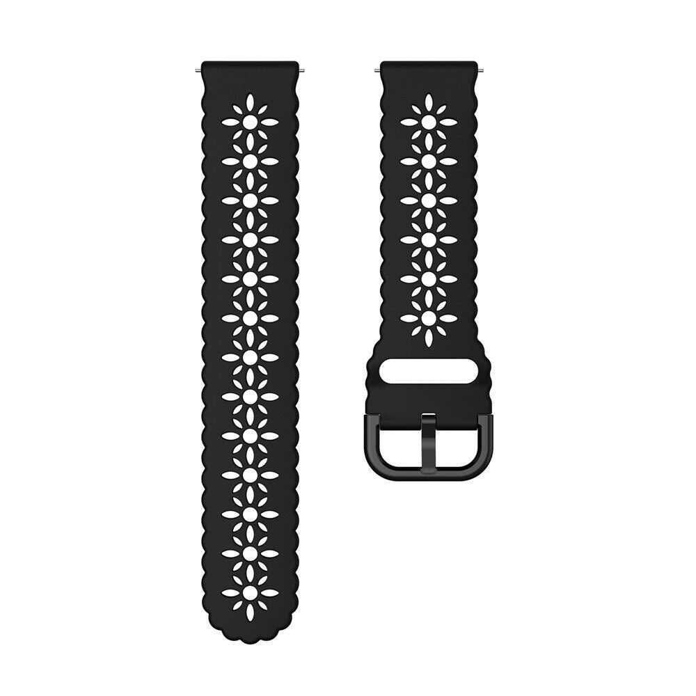 Zwei schwarze Uhrenarmbänder mit Blumenausschnitten. Ein Armband hat eine Schnalle. Beide sind vor weißem Hintergrund.