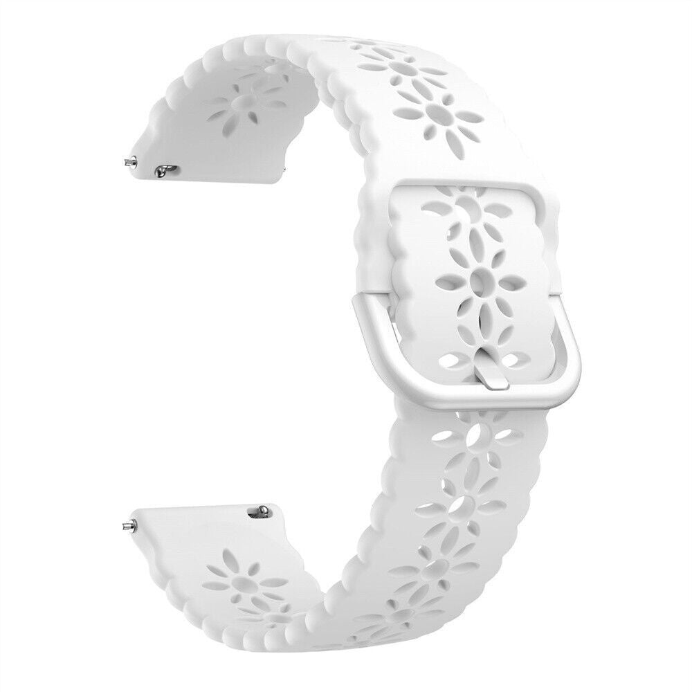 Ein weißes Uhrenarmband mit floralen Aussparungen ist abgebildet. Eine silberne Schnalle ist vorhanden. Das Band hat einen gewellten Rand.
