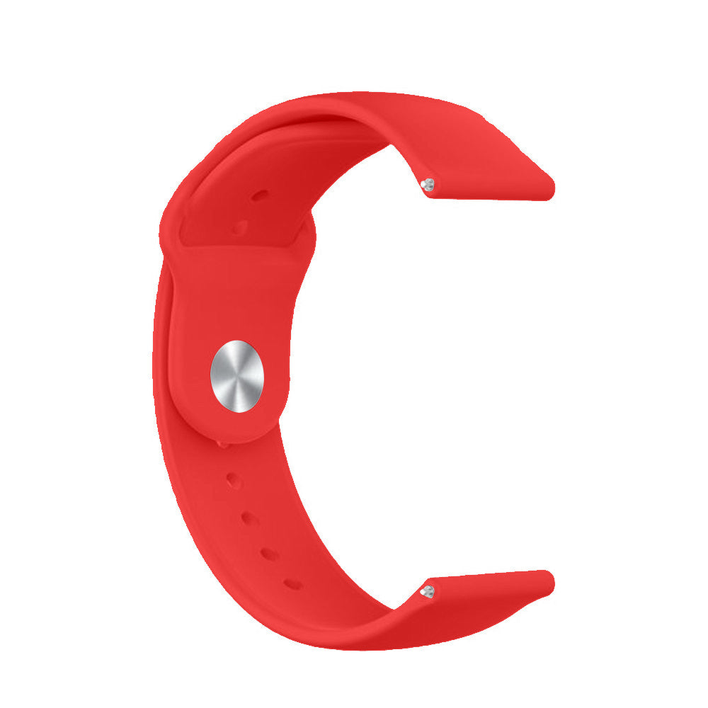 Ein rotes, gebogenes Uhrenarmband. Es hat einen silbernen Knopf und kleine Löcher. Das Armband befindet sich auf weißem Hintergrund.