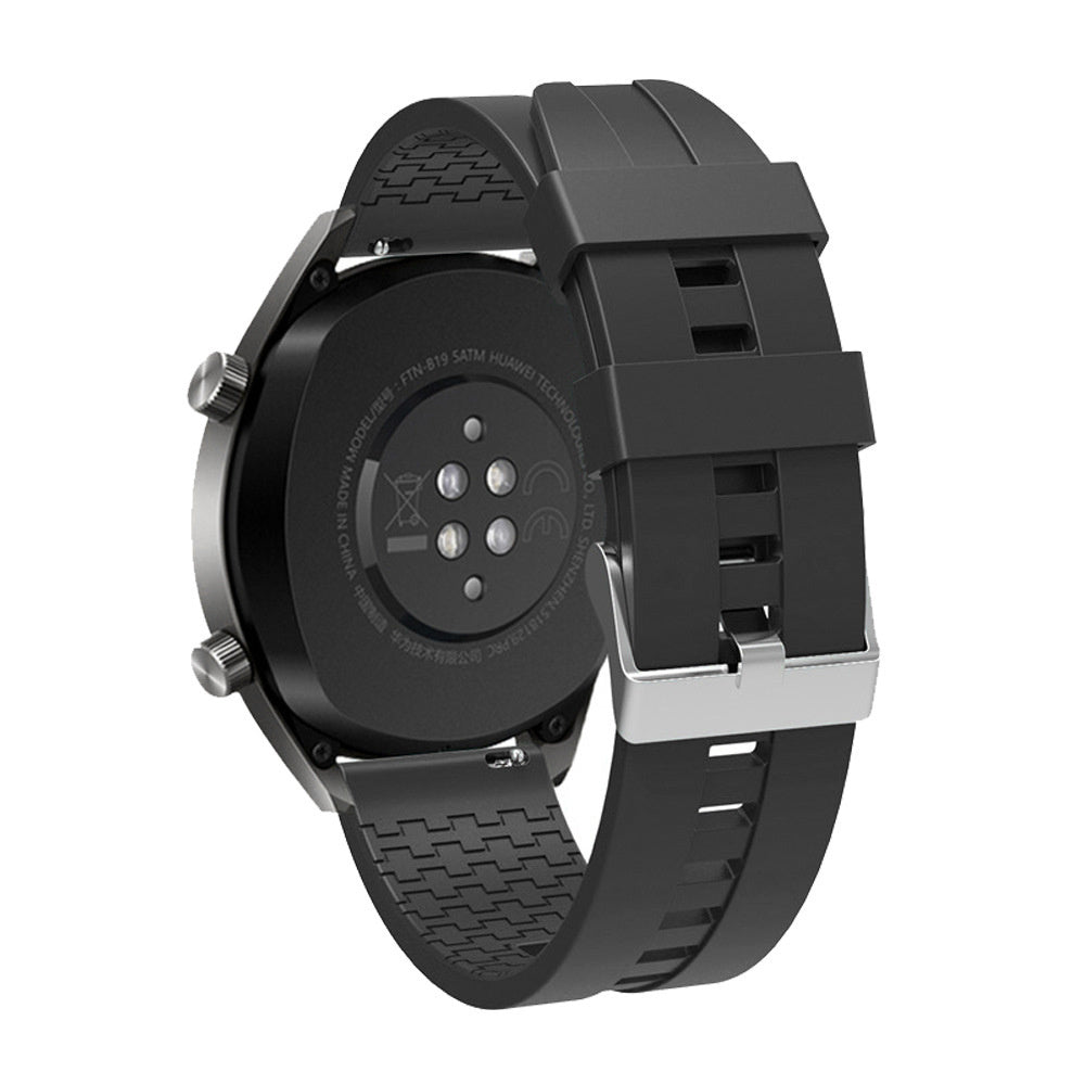 Schwarze Smartwatch mit schwarzem Armband und silberner Schnalle. Die Rückseite zeigt Sensoren und Modelldetails.