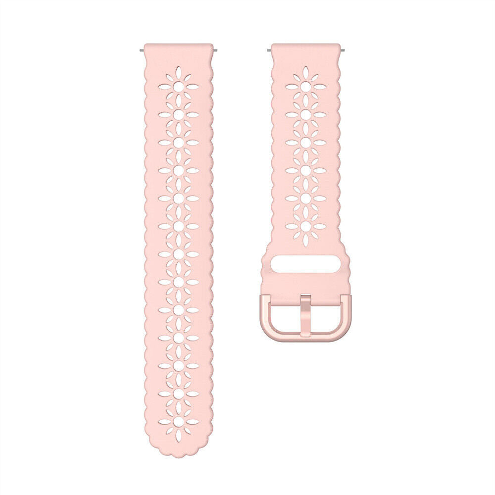 Zwei rosa Uhrenarmbänder mit Blumenausschnitten. Eines hat eine Schnalle. Beide haben einen gewellten Rand und sind auf weißem Hintergrund.
