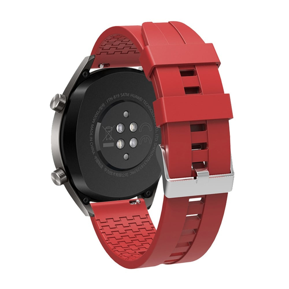 Eine schwarze Smartwatch mit rotem Armband wird gezeigt. Die Uhr ist abgewinkelt und zeigt die Rückseite und einen Teil des Armbands.