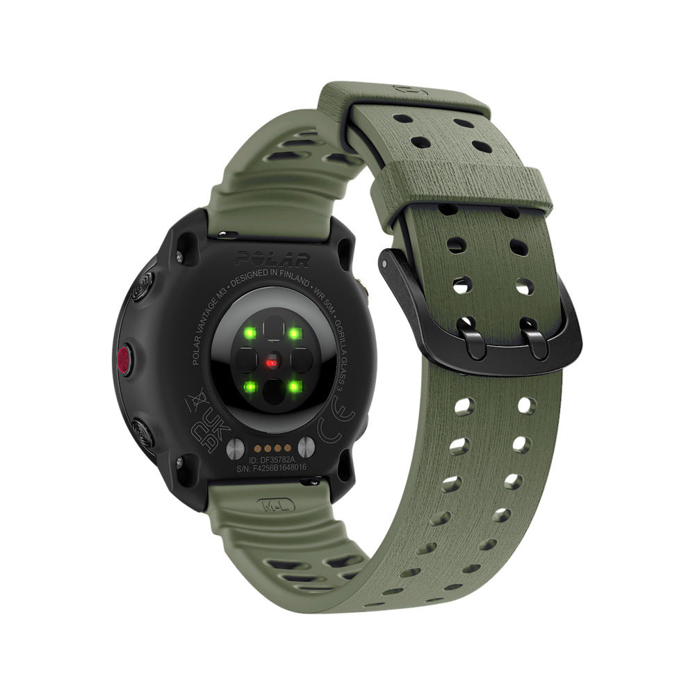 Eine schwarze Polar Vantage M3 Smartwatch mit grünem Armband. Die Rückseite der Uhr zeigt Sensoren und Textdetails. Das Armband hat eine schwarze Schnalle.