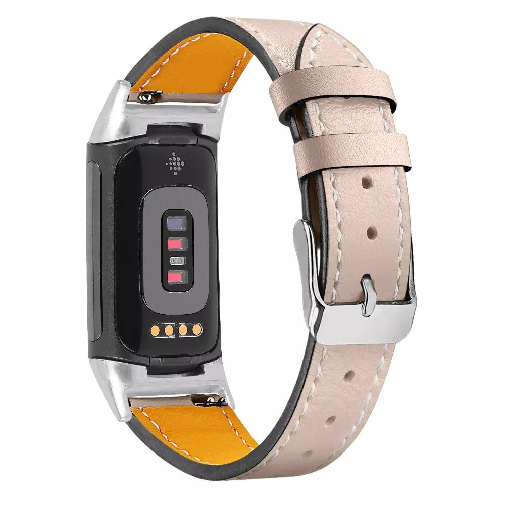 Ein Smartwatch-Armband mit schwarzem Bildschirm, hellrosa Lederarmband und silberner Schnalle. Gelbes Futter ist sichtbar.